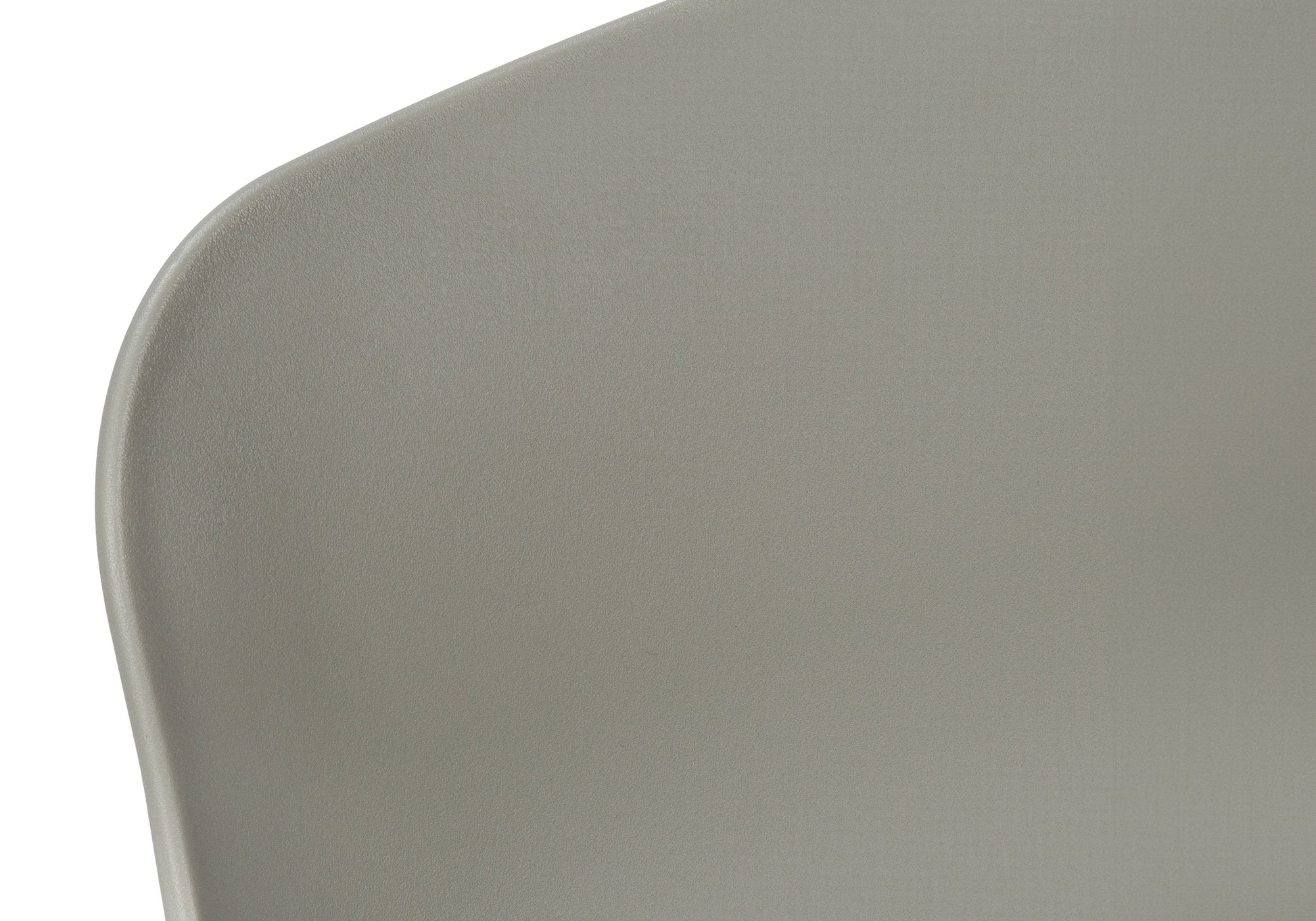 Closeup of a textured grey plastic chair back modern design