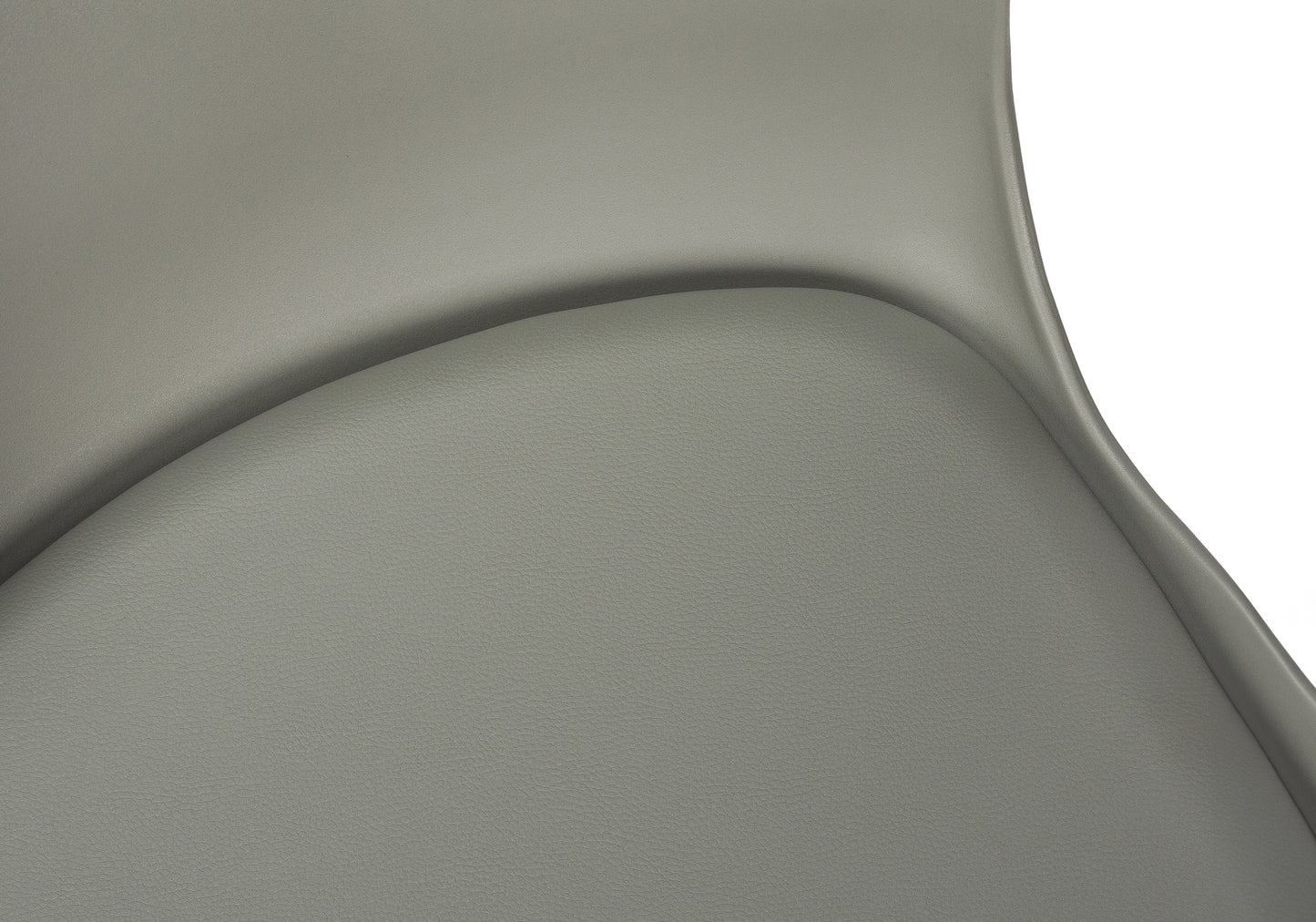Textured grey faux leather upholstery on a modern accent chair