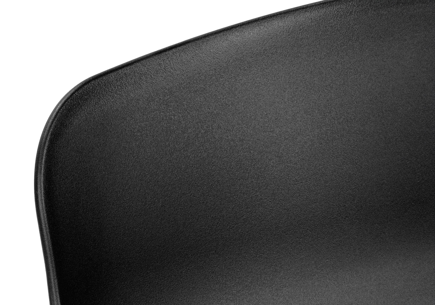 Closeup of textured black plastic chair seat modern design