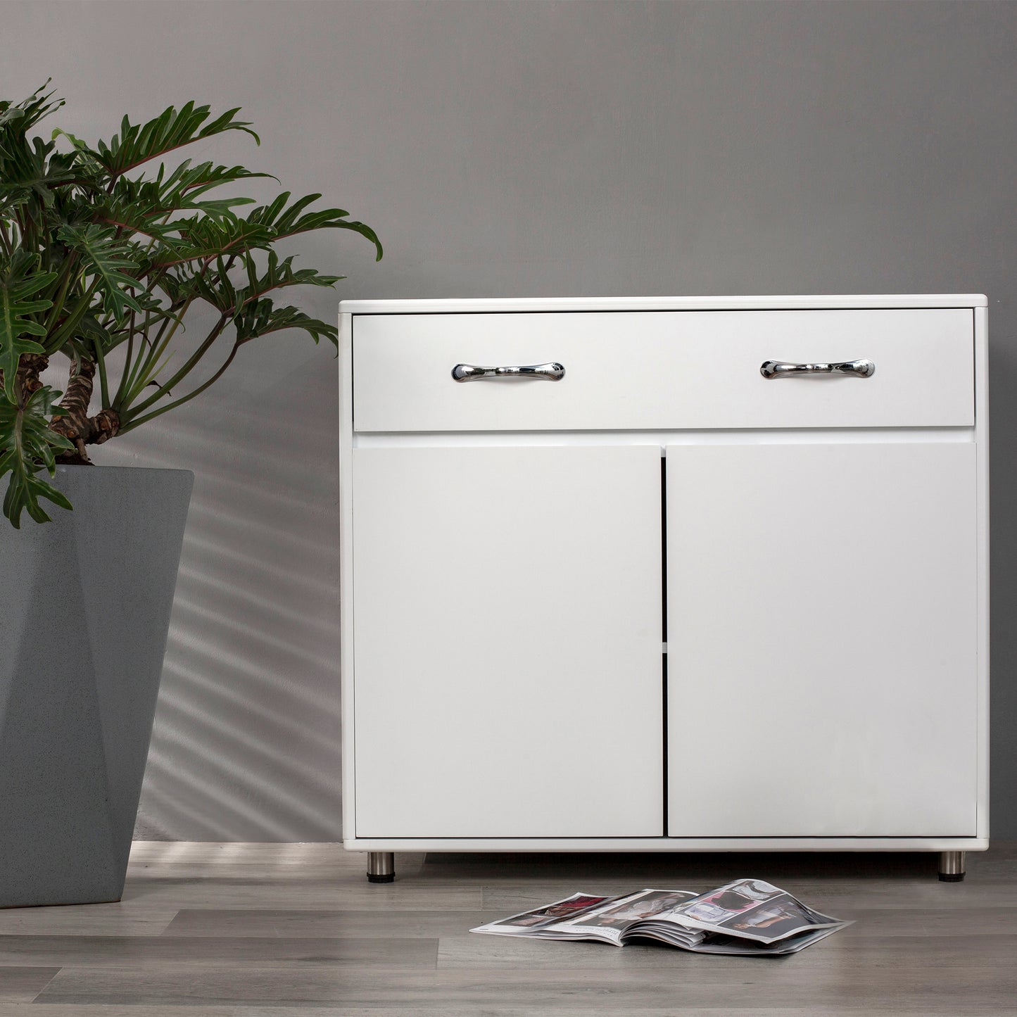 White twodrawer and twodoor modern cabinet with chrome handles