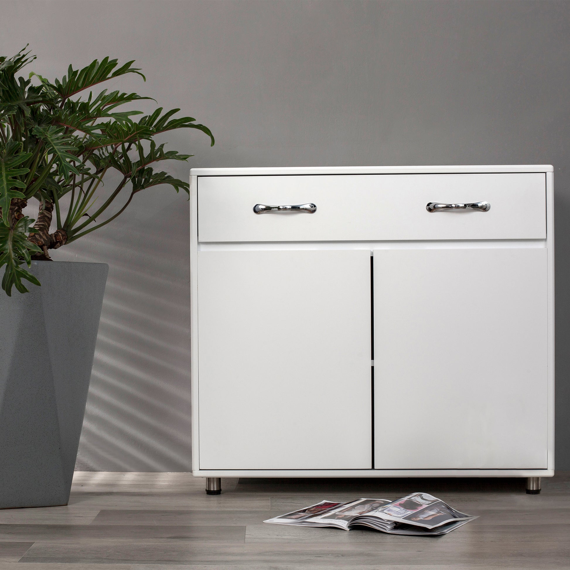 White twodrawer and twodoor modern cabinet with chrome handles