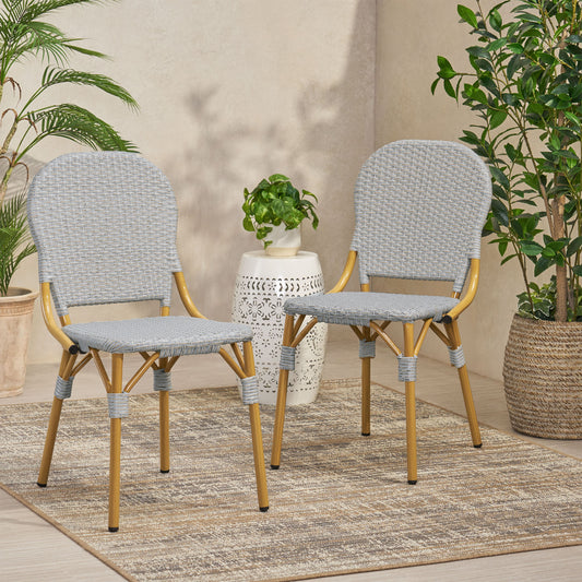Pair of grey rattan bistro chairs with gold metal legs perfect for outdoor dining