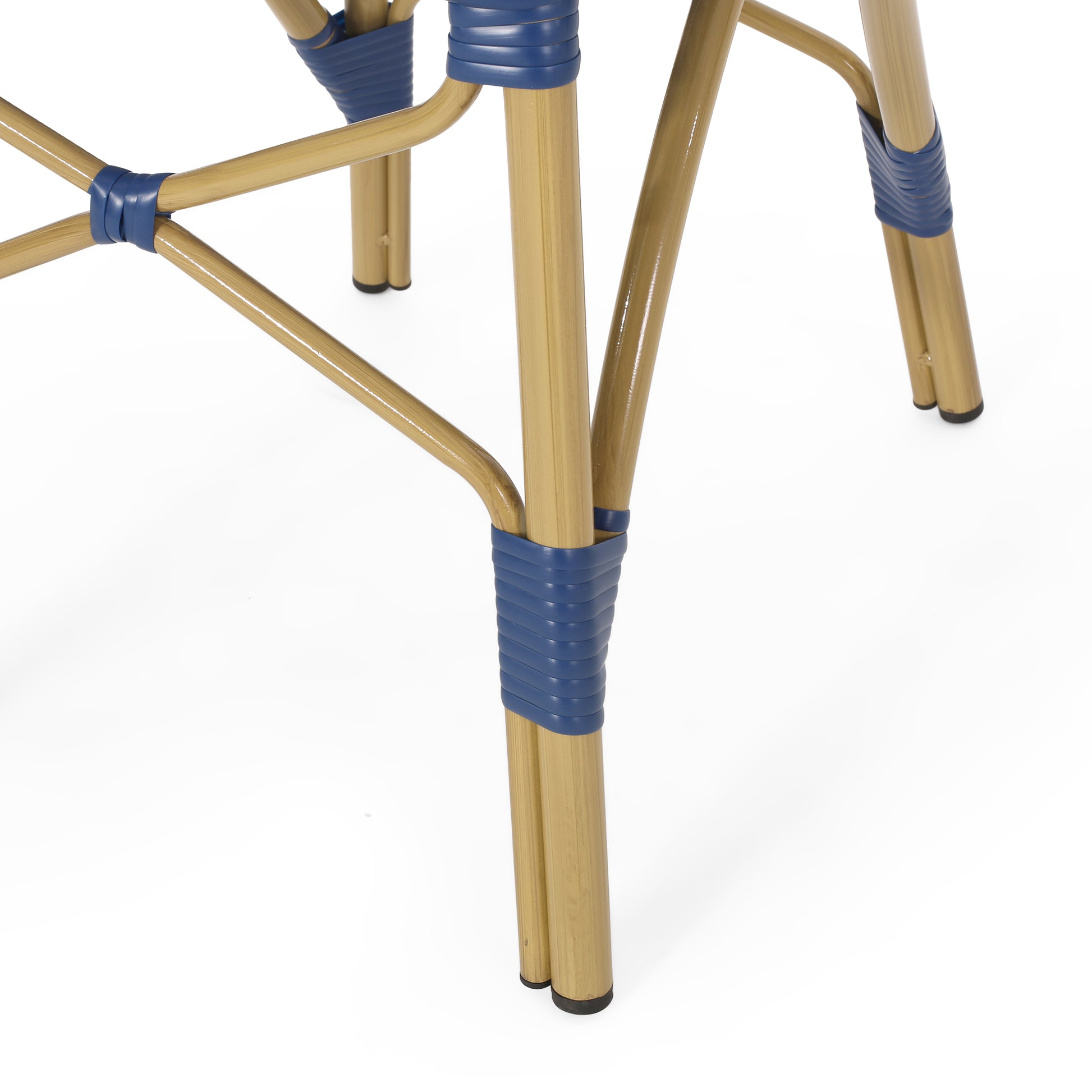 Golden metal chair legs with blue woven rattan accents