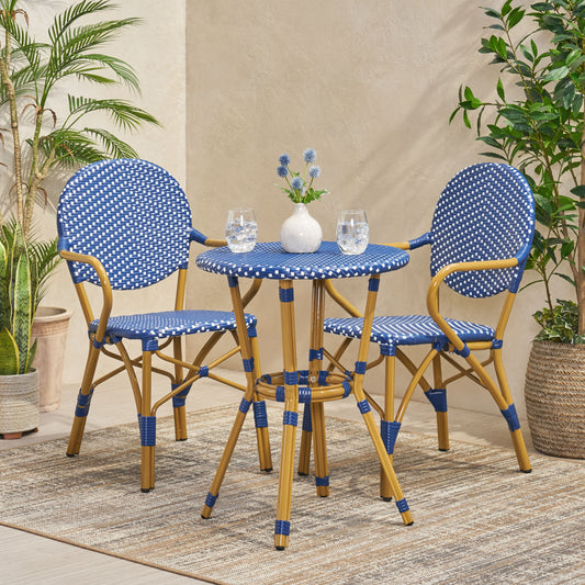 Blue and white bistro set with woven rattan chairs and round table