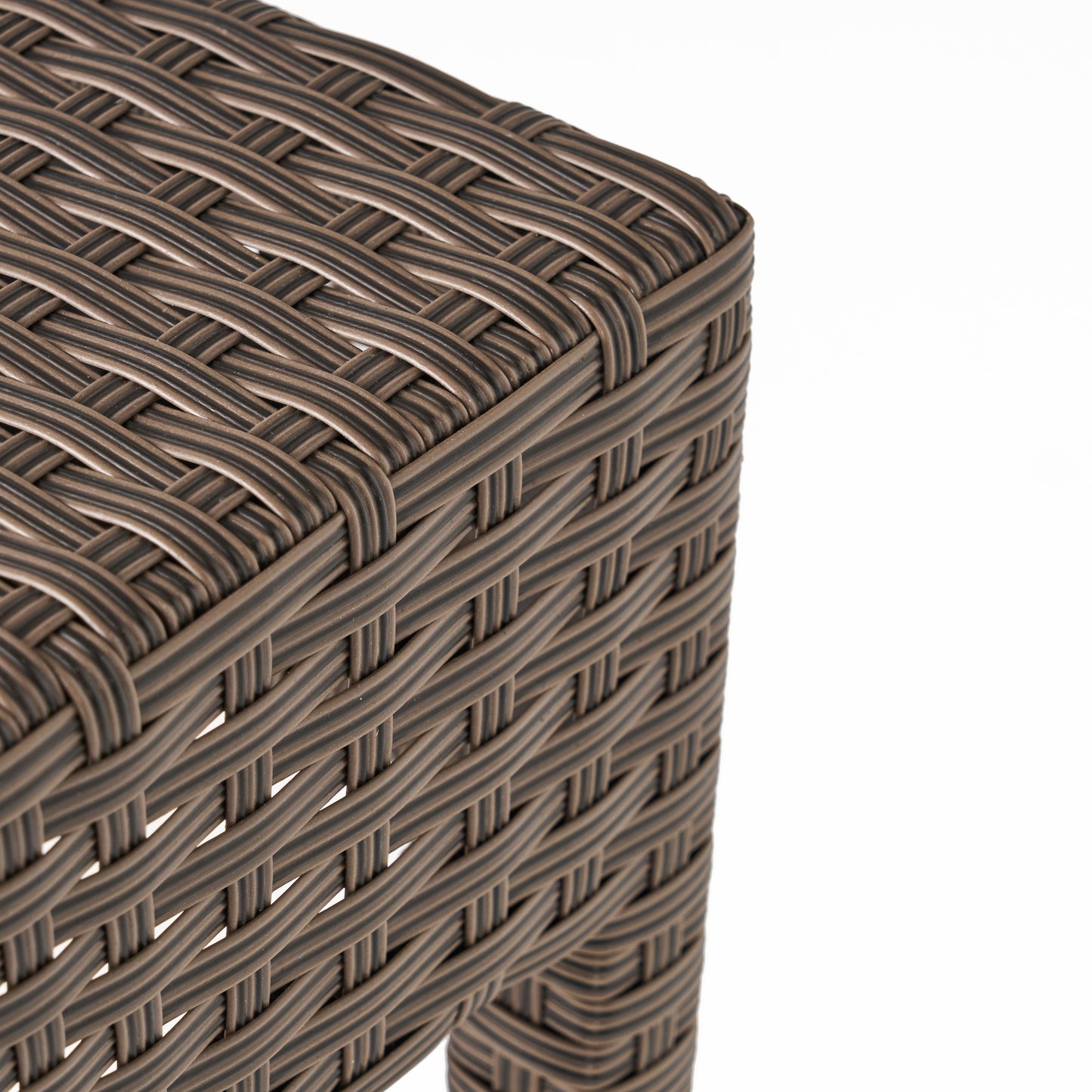 Closeup of a brown wicker weave texture on an outdoor furniture piece