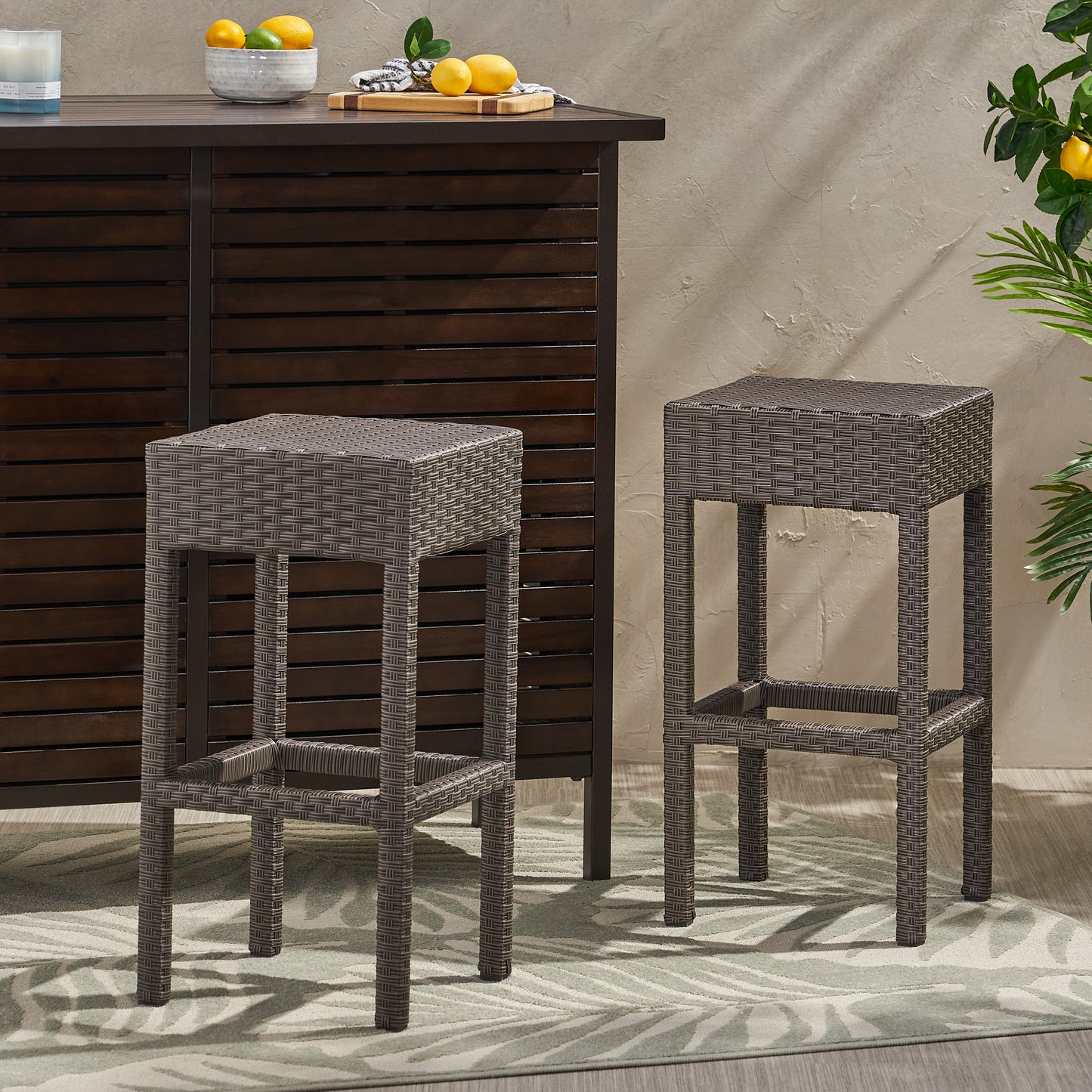 Brown wicker bar stool with durable weave pattern perfect for outdoor entertaining