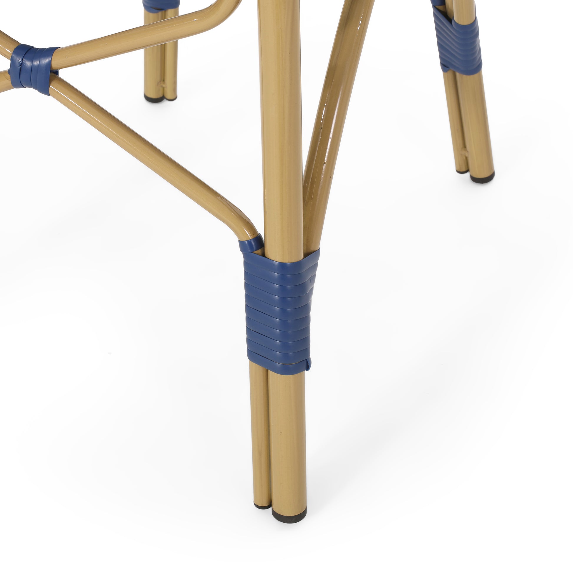Gold metal table legs with blue rattan detailing