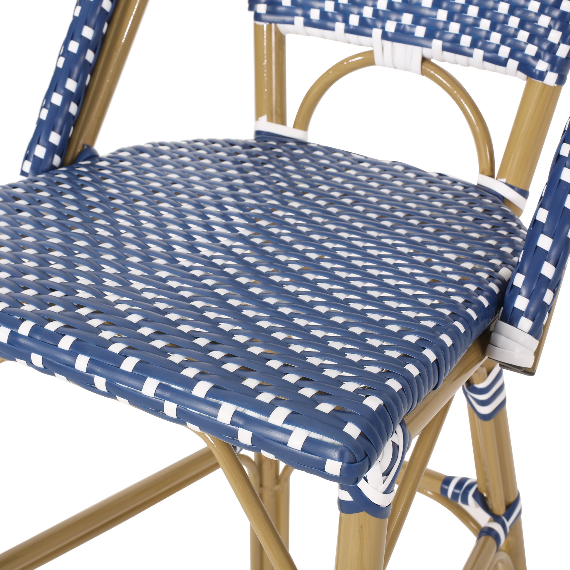 Closeup of blue and white woven seat of a French cafe chair