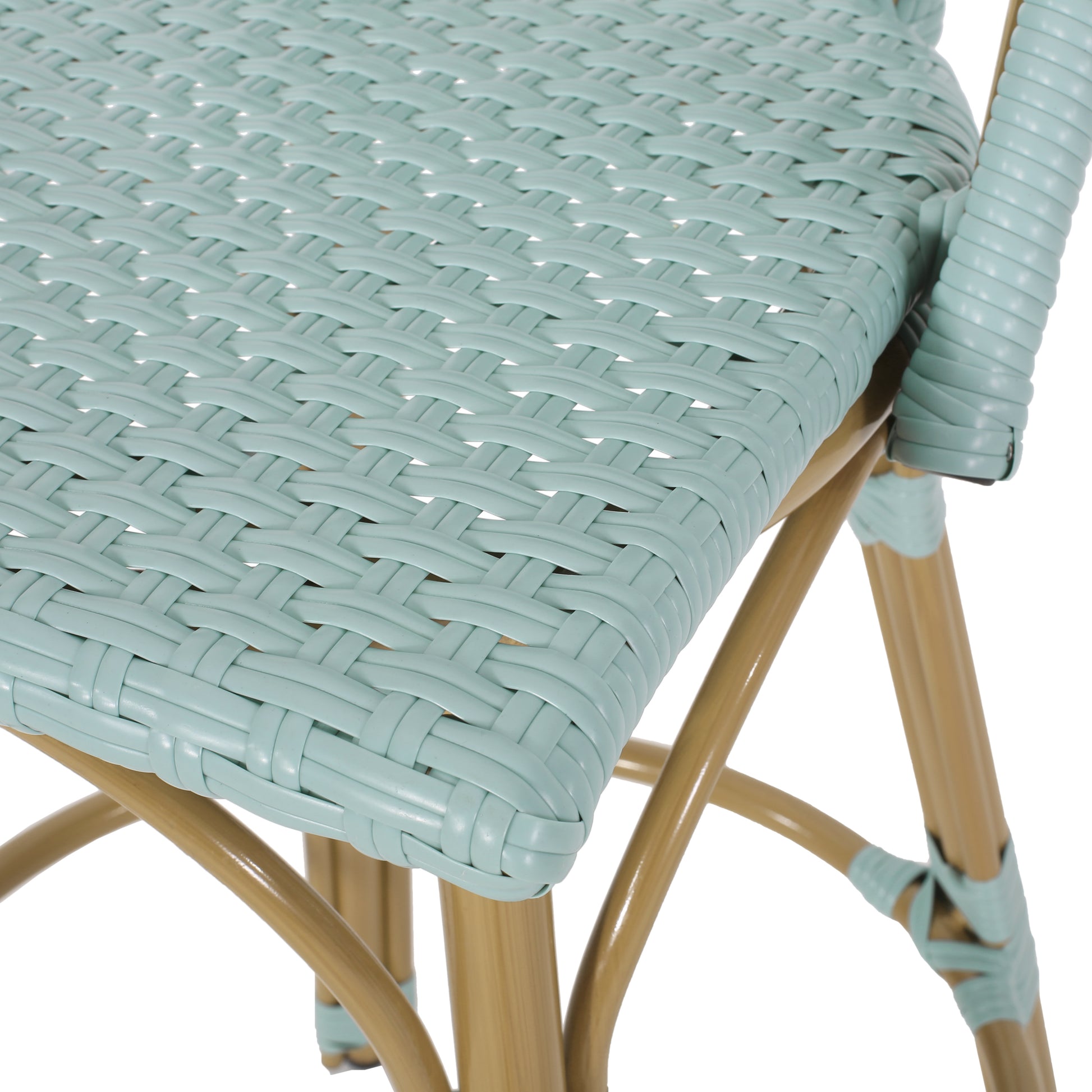 Closeup of a pale blue woven resin bistro chair seat with tan metal legs