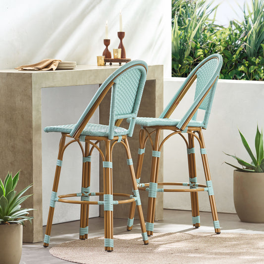 Two light blue rattan bar stools with natural wood legs and accents ideal for outdoor patio seating
