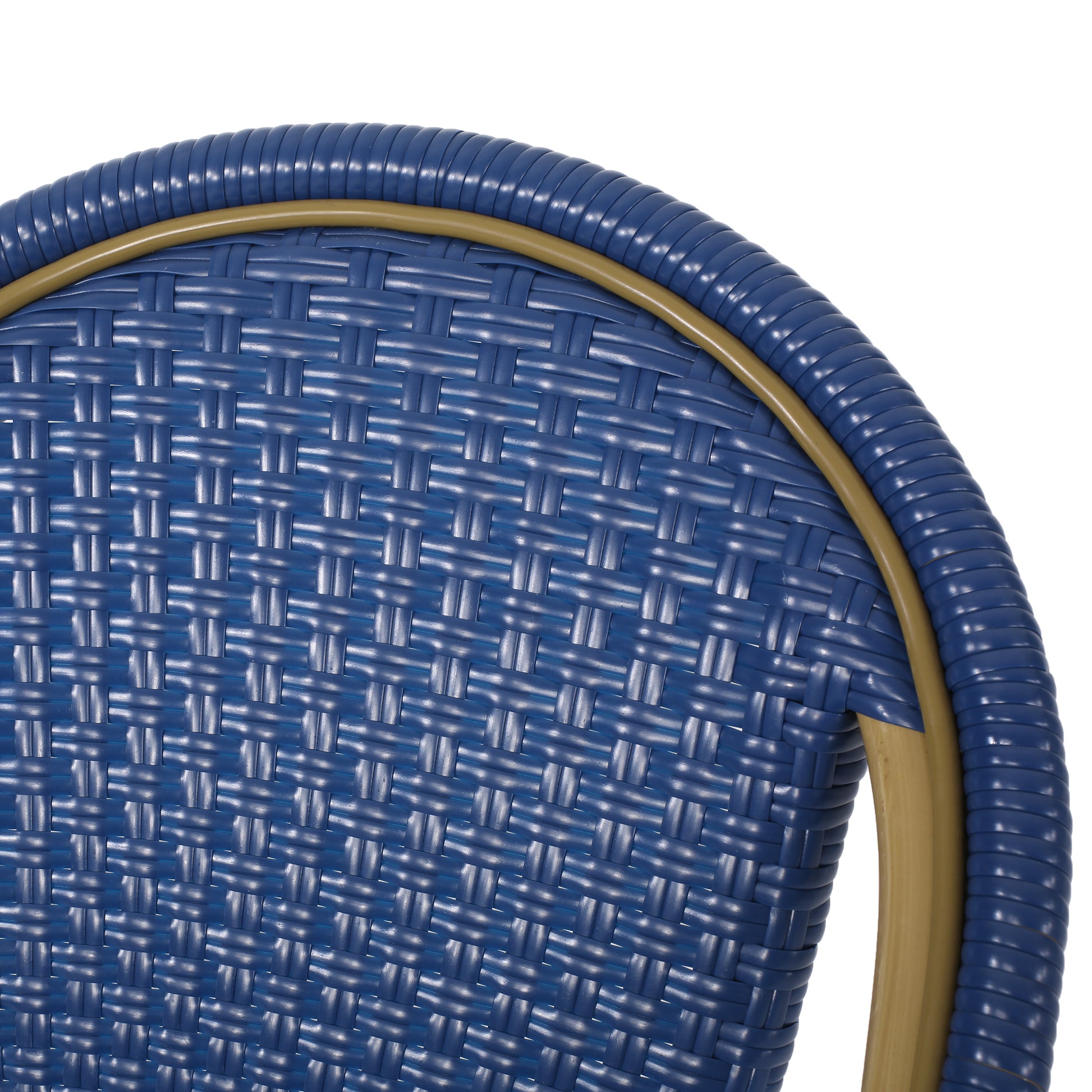 Closeup of a navy blue woven resin chair back with a tan frame accent