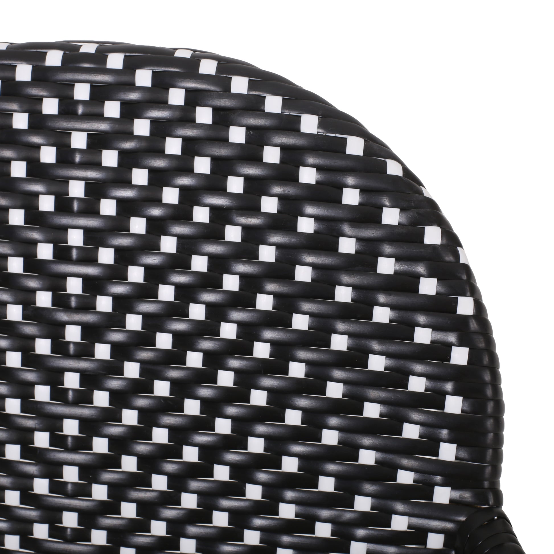 Black and white woven wicker chair seat detail with a checkered pattern