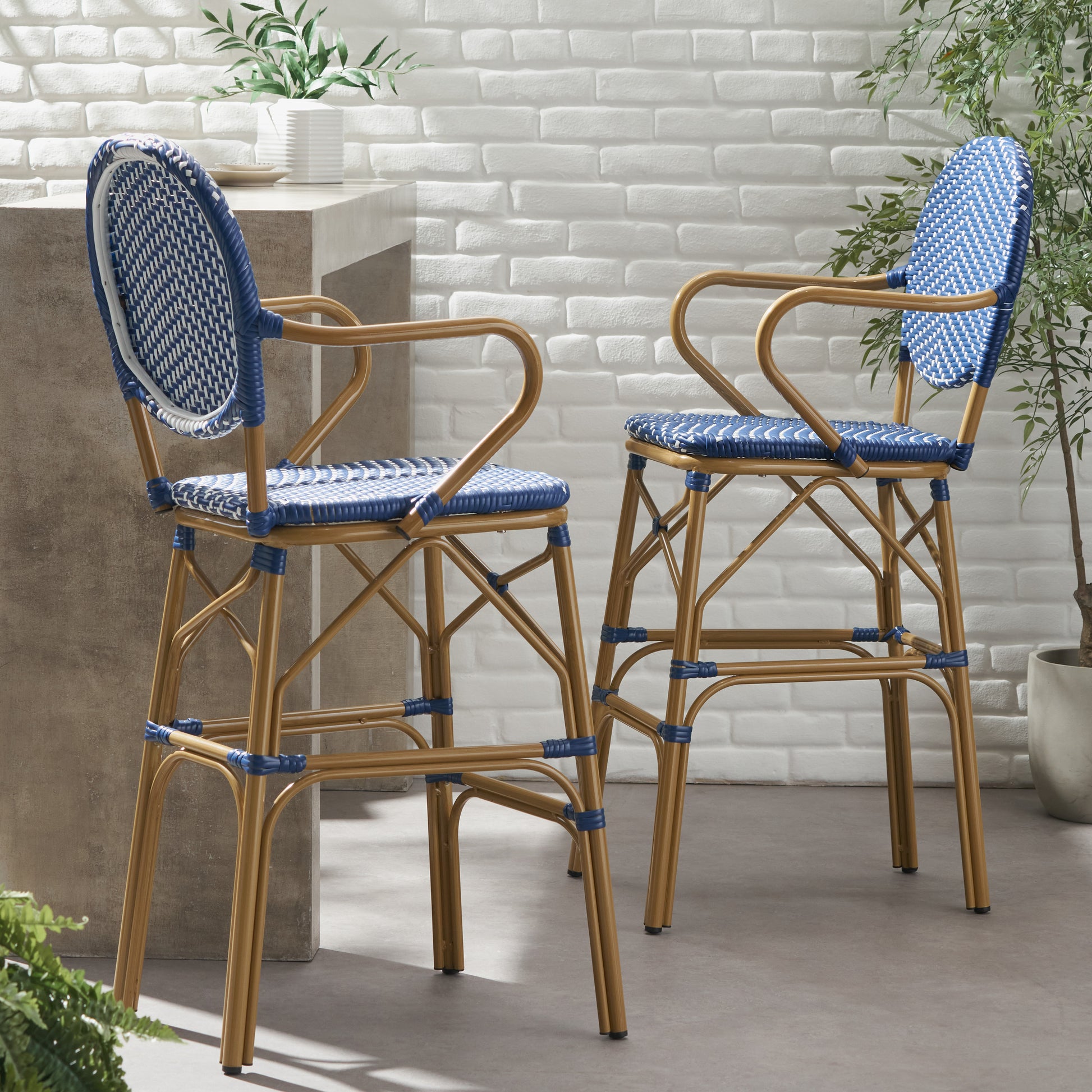 Blue and white woven rattan bar stool with curved arms and natural woodtone frame