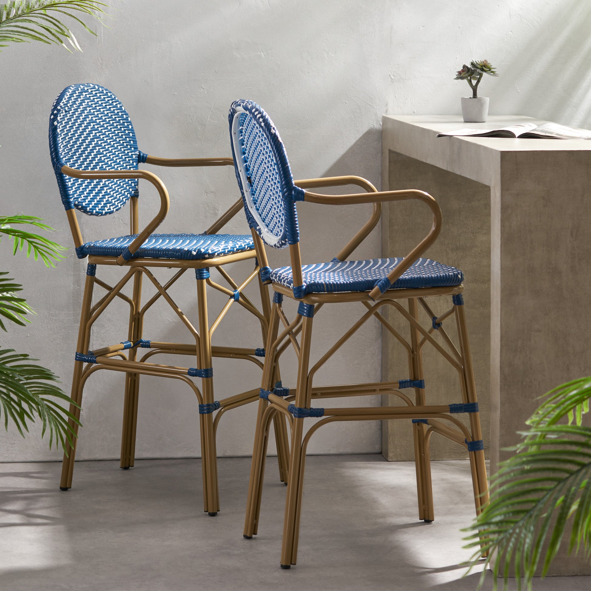 Classic bistro bar stool in blue and white wicker with a gold metal frame for modern kitchens