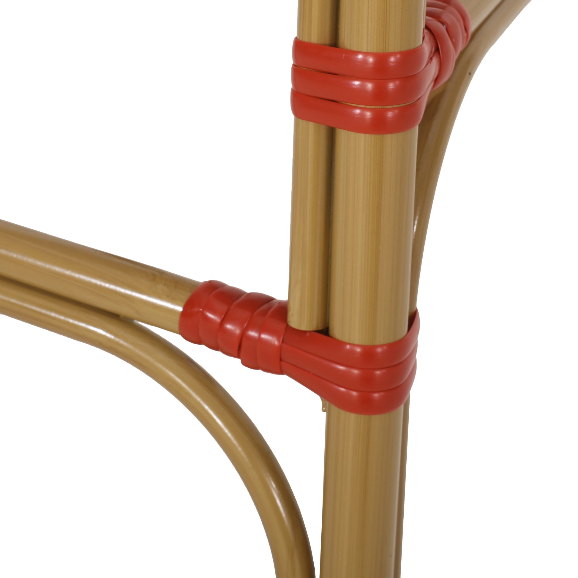 Closeup of natural tan bamboo poles for a patio chair wrapped with red resin binders