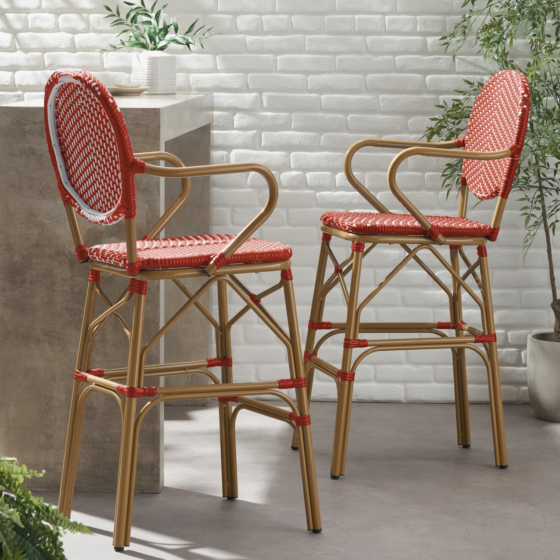 Red and white wicker bar stool with gold metal frame perfect for outdoor seating