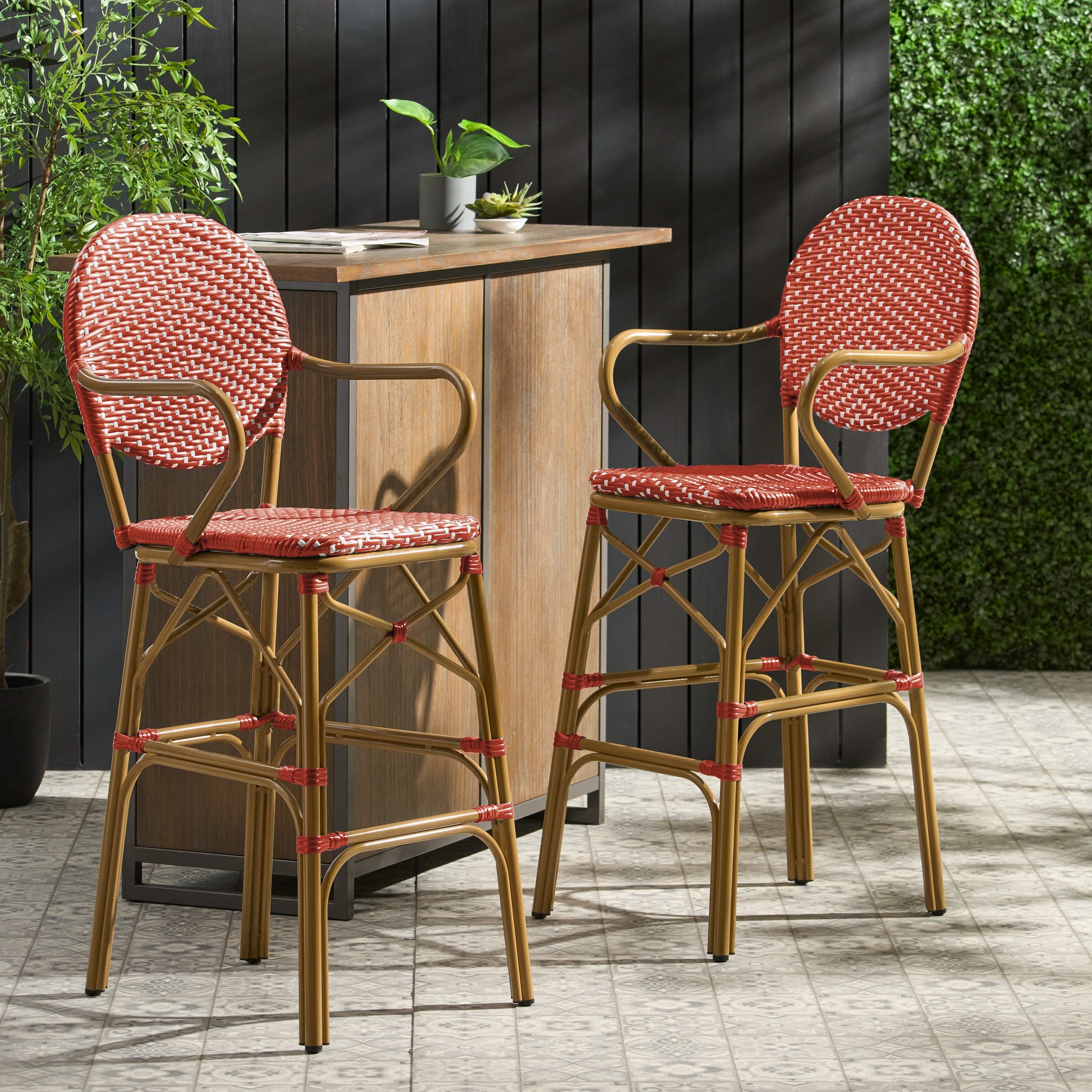 Red and white woven rattan bar stools with gold metal frames perfect for outdoor seating