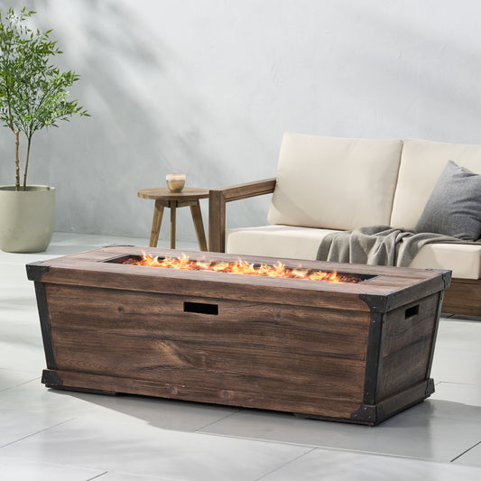 Rustic wood patio fire pit table with metal accents creating a warm outdoor ambiance