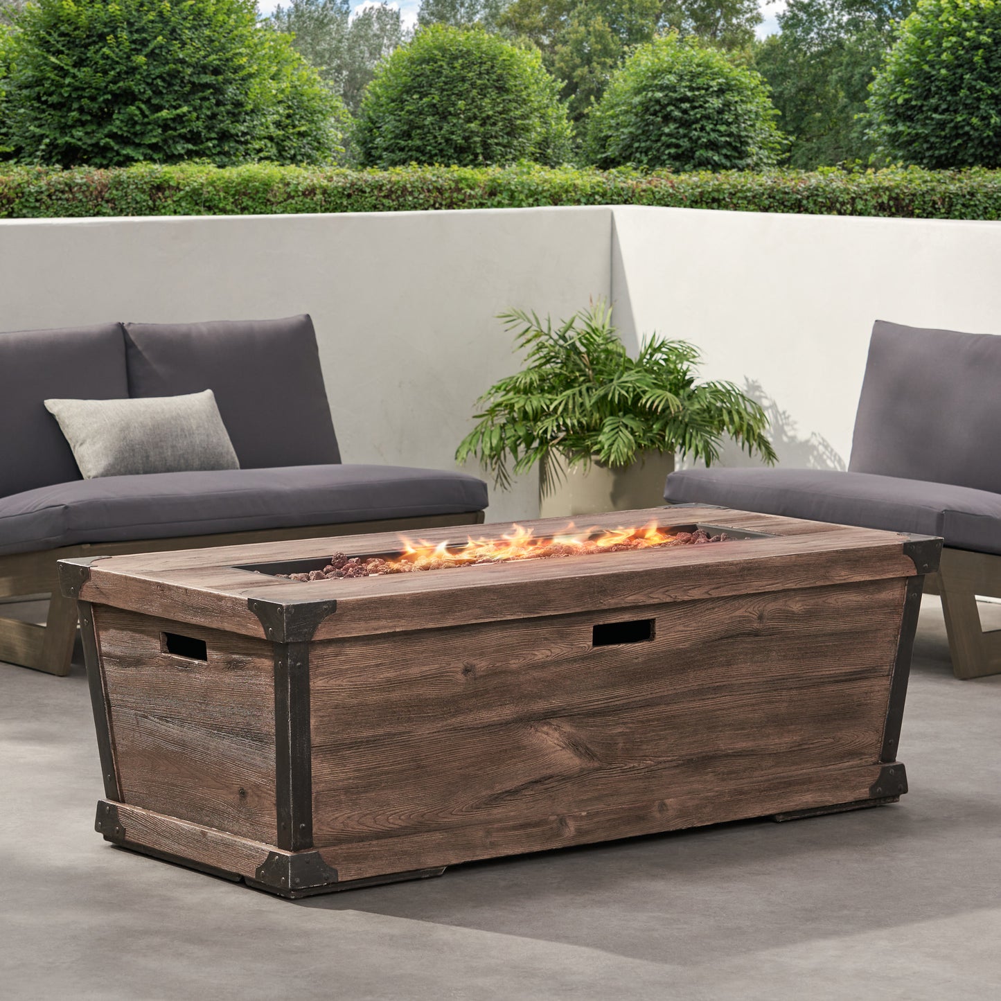 Rustic wooden gas fire pit table with dark metal accents and decorative lava rocks  characters
