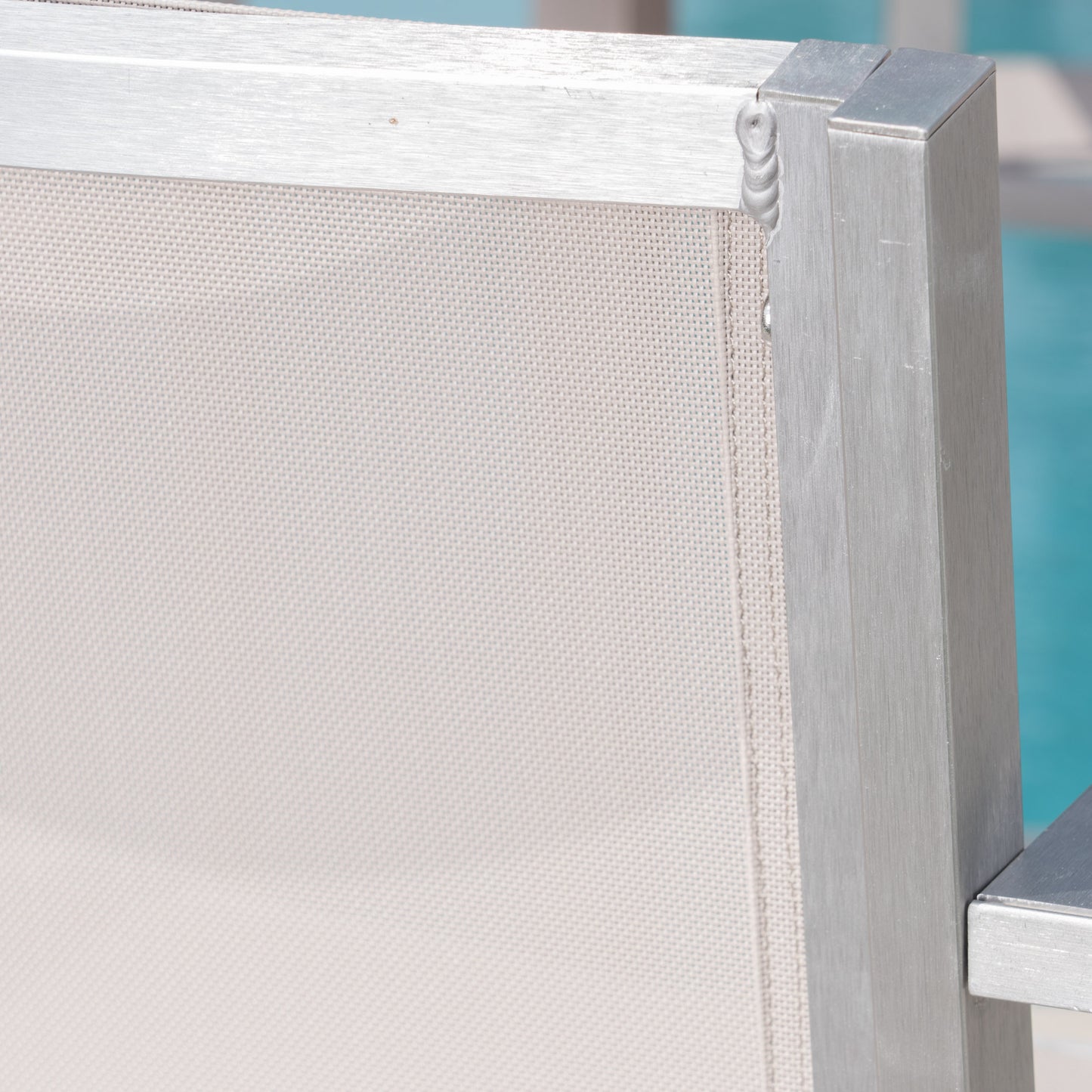 Aluminum framed patio chair with beige textilene sling seat