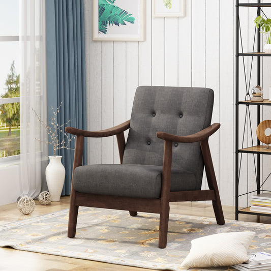 Dark gray fabric armchair with midcentury modern wood frame and button tufting
