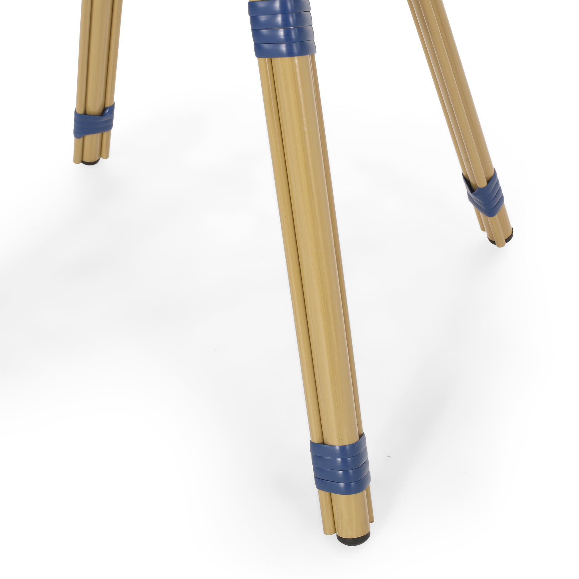 Tan bamboo tripod legs with blue accents