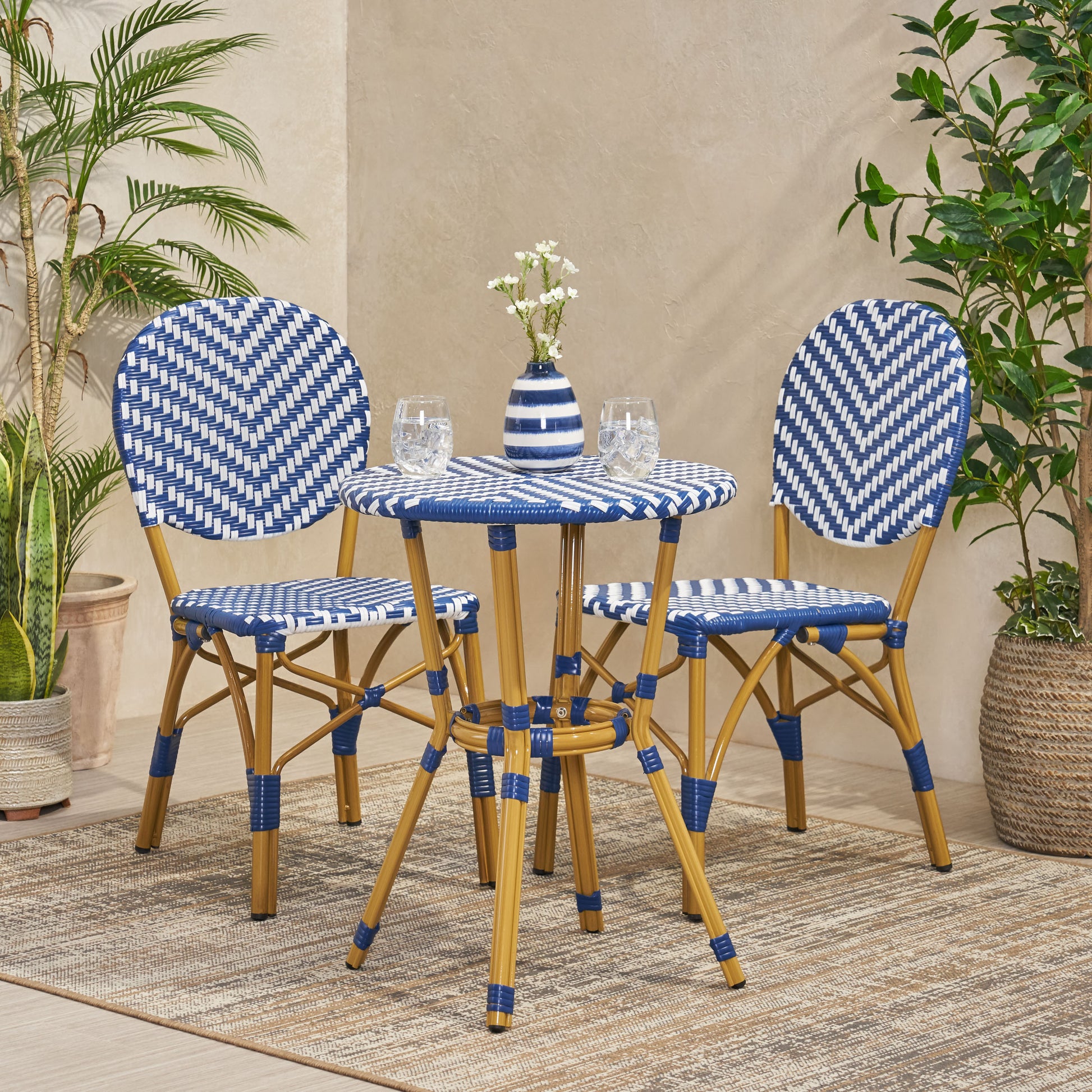 Blue and white bistro chairs and table set with woven rattan detail