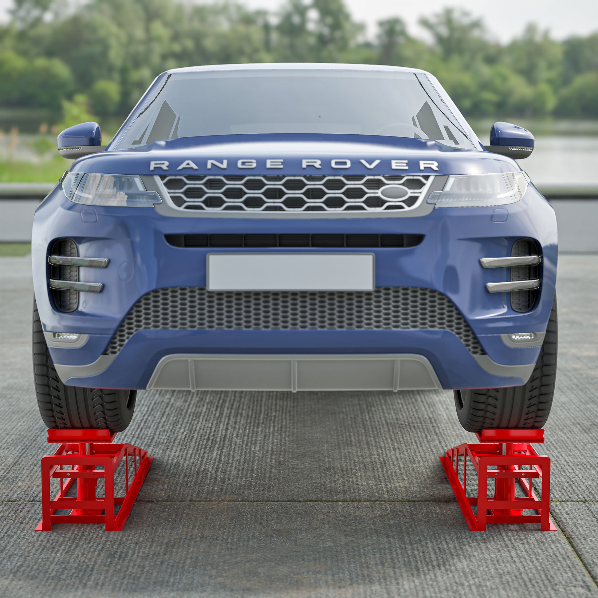 Blue Range Rover on red car ramps for tire service front view