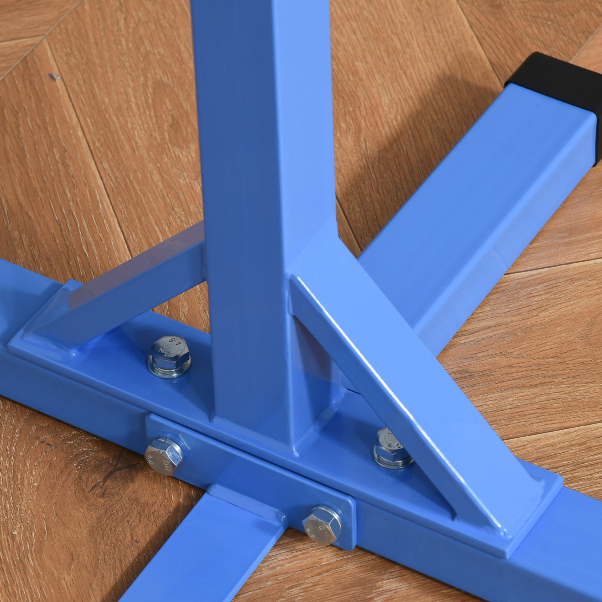 Blue metal power tower base with sturdy steel construction and visible bolts