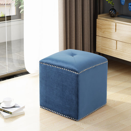 Square blue velvet ottoman with studded trim and tufted top