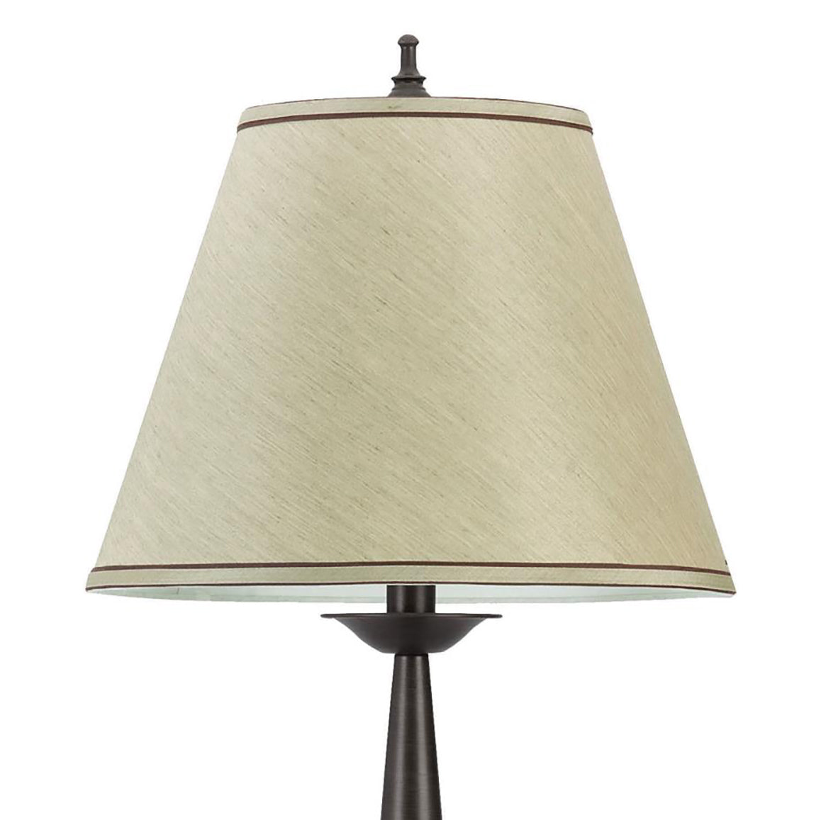 Textured beige lampshade with dark trim accentuating a classic bedside lamp