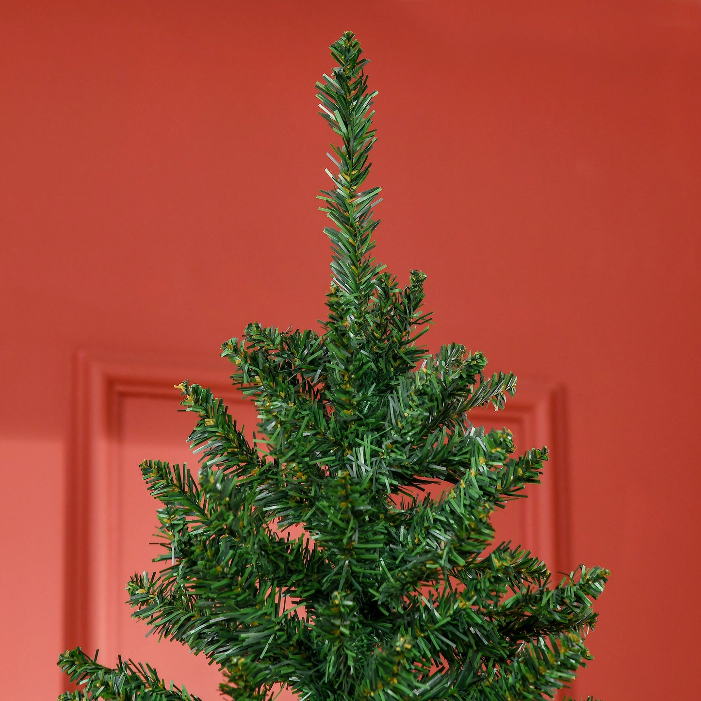 Closeup of a realistic artificial christmas trees green PVC needles with warm yellow tips
