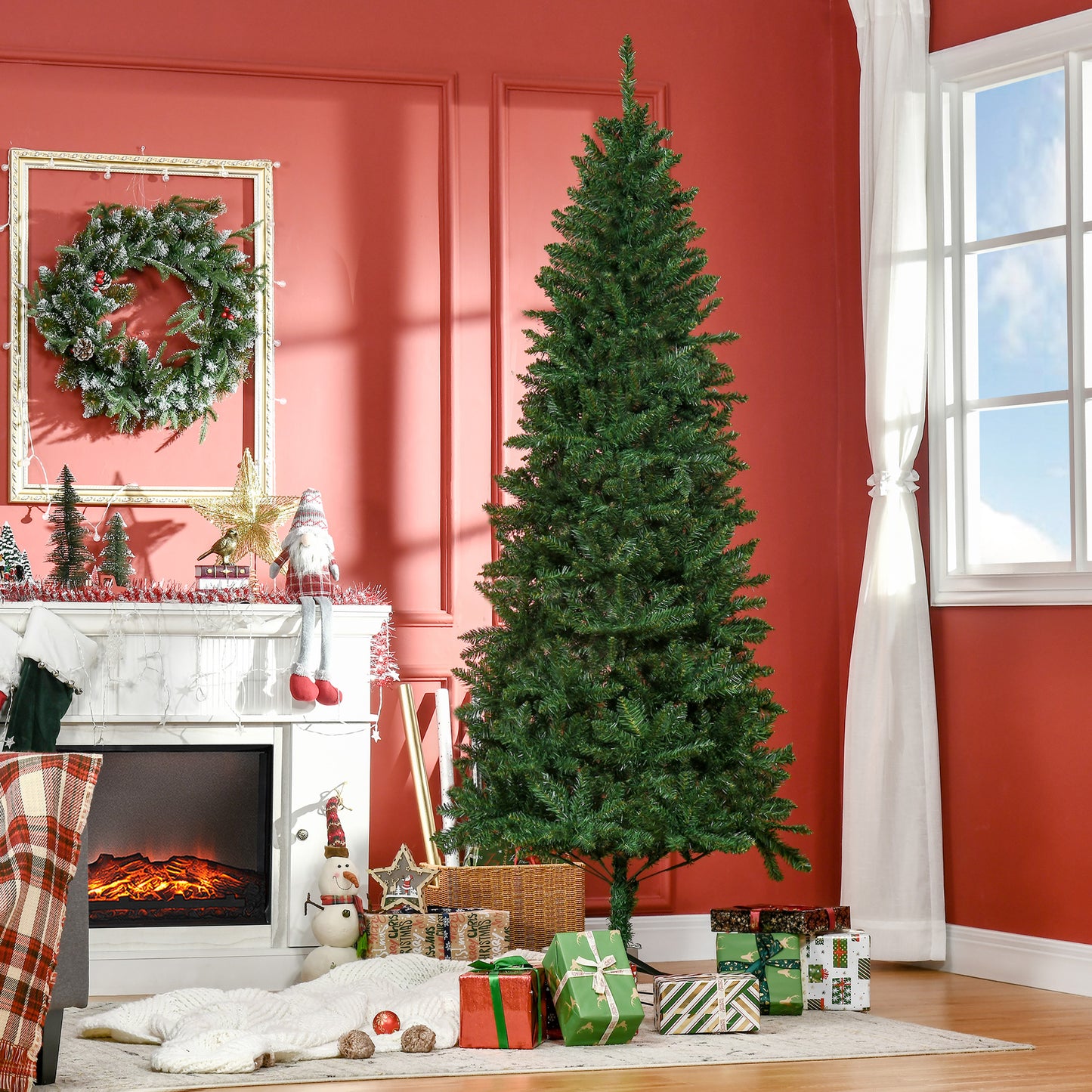 Full artificial Christmas tree in a festive living room setting with presents