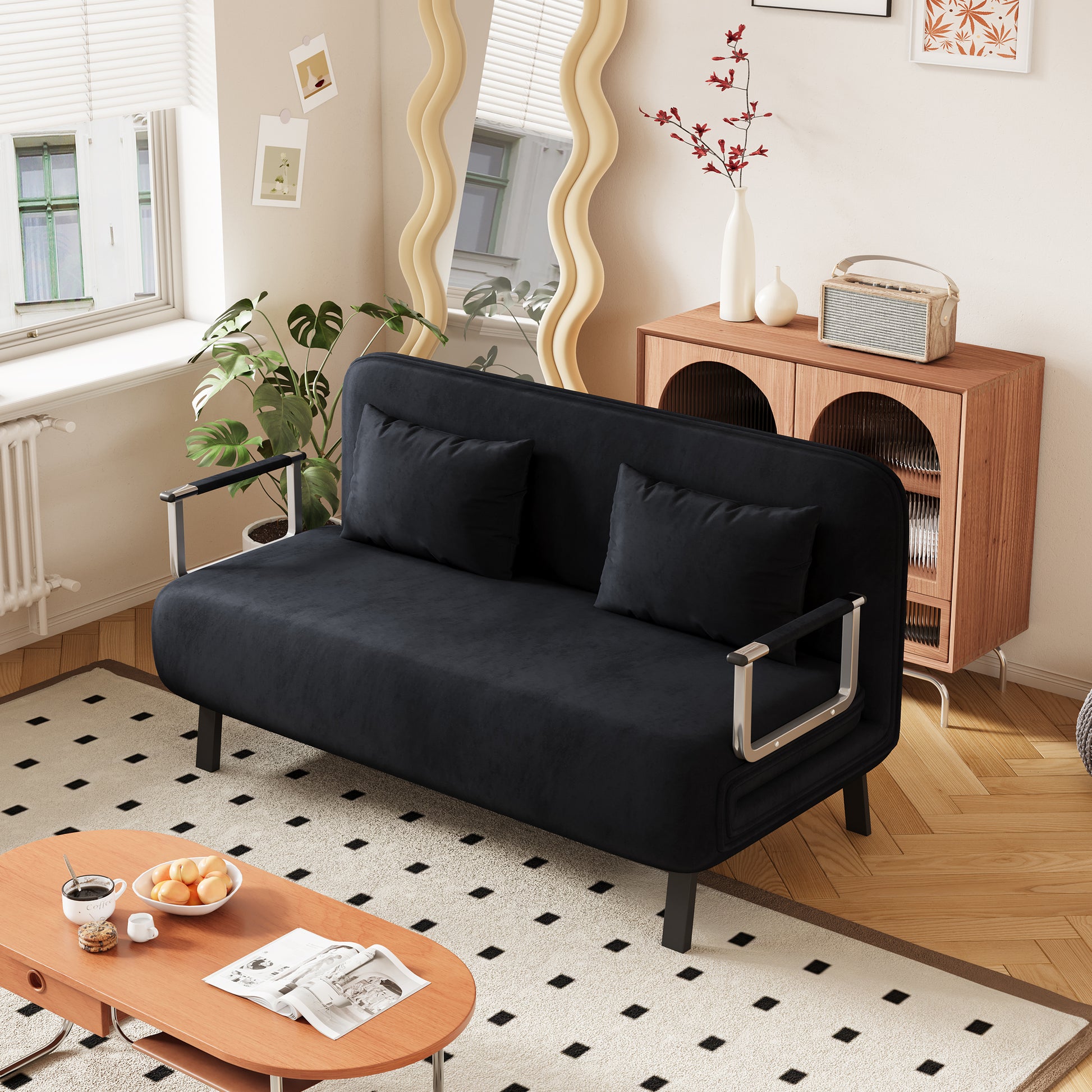 Black velvet futon sofa with chrome accents two plush pillows perfect for small apartments
