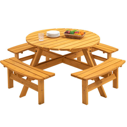 Wooden round picnic table with attached benches set for outdoor dining