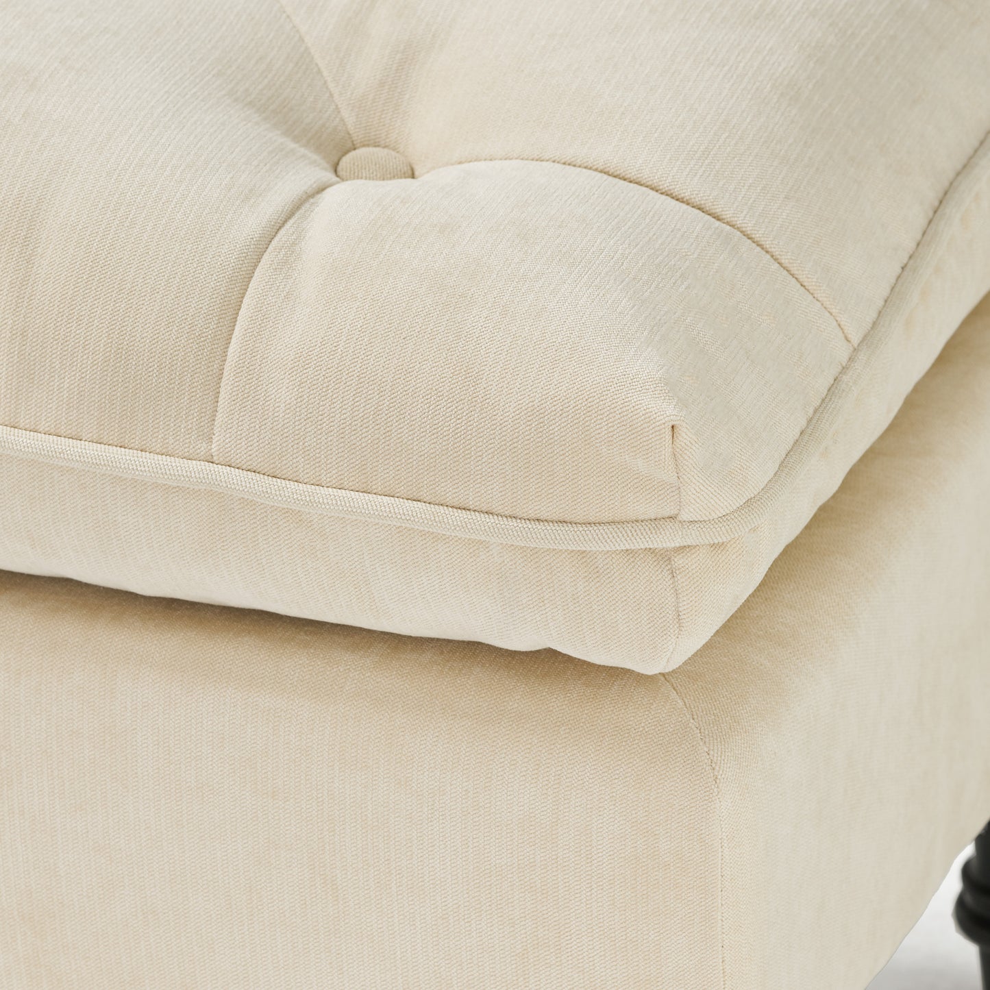 Tufted cream linen ottoman cushion with piped edge detail