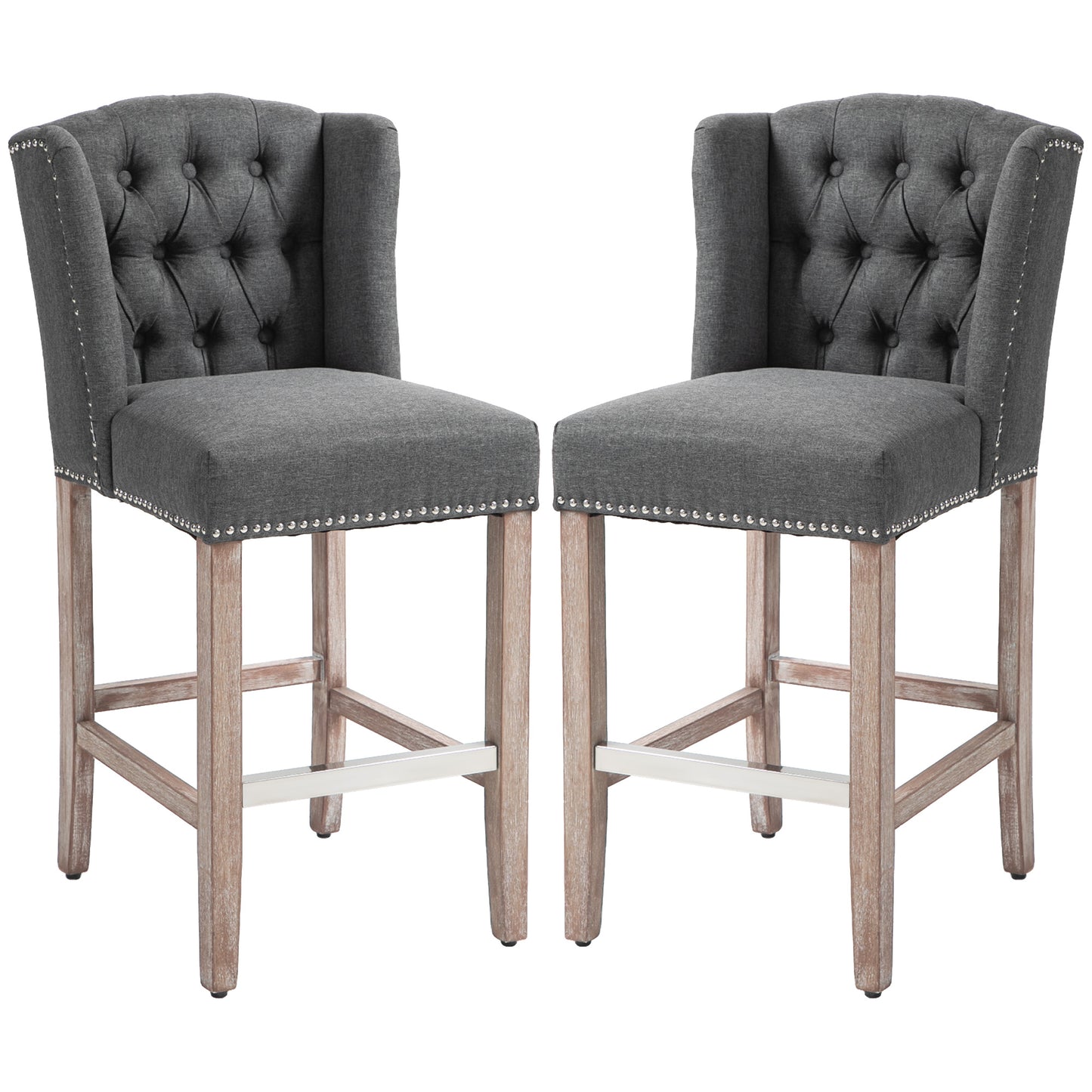 Two grey tufted bar stools with silver nailhead trim and natural wood legs