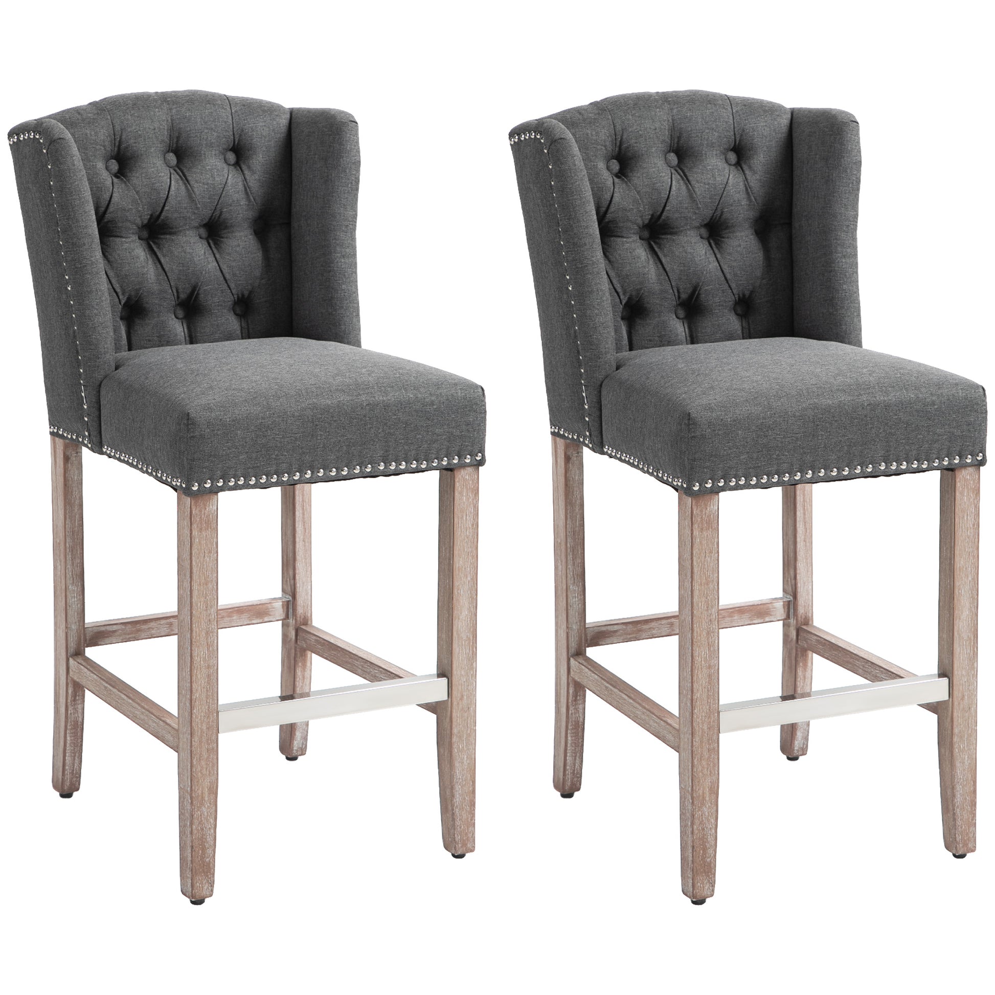 Set of two dark grey tufted fabric bar stools with nailhead trim and distressed wood legs