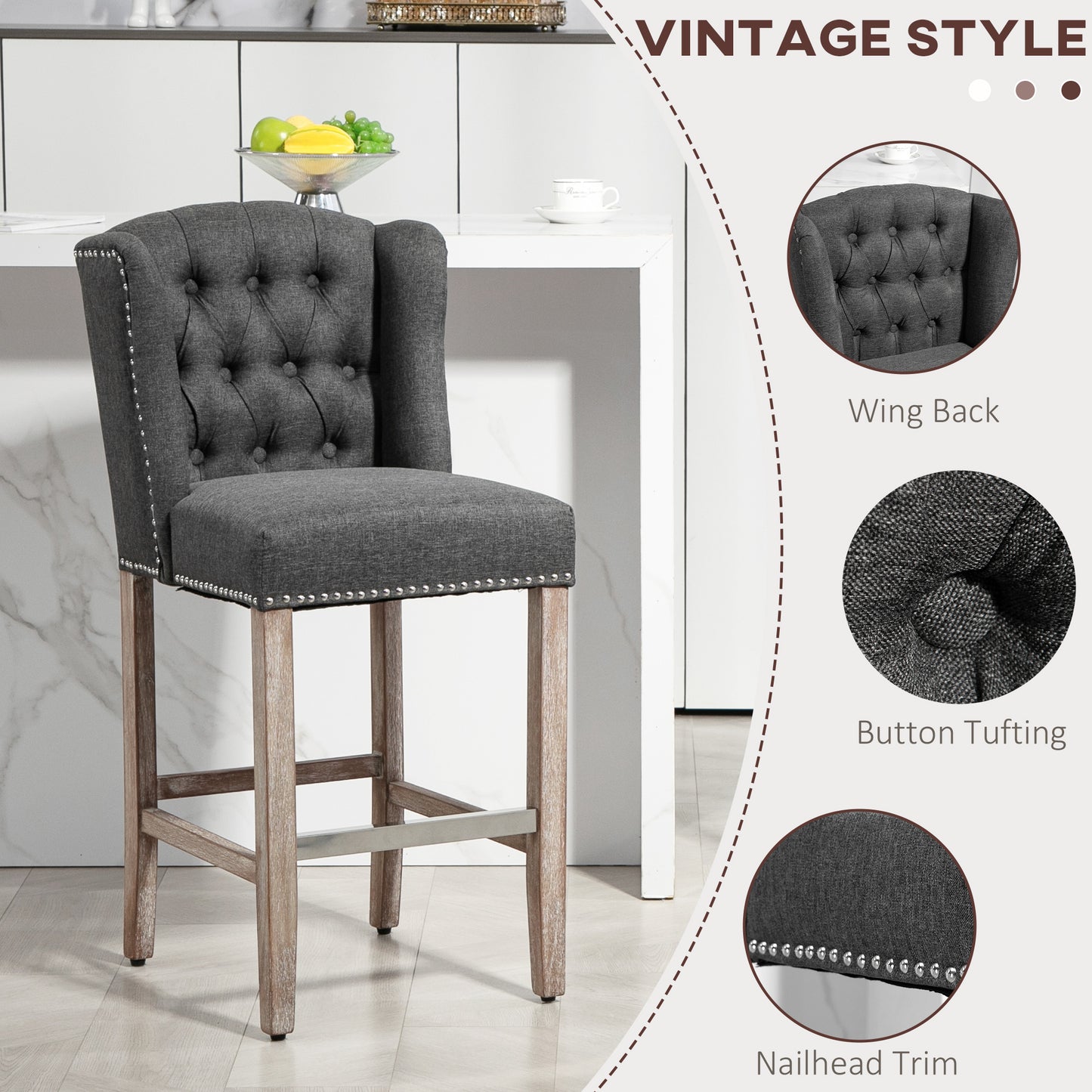Dark gray upholstered bar stool with button tufting and nailhead trim