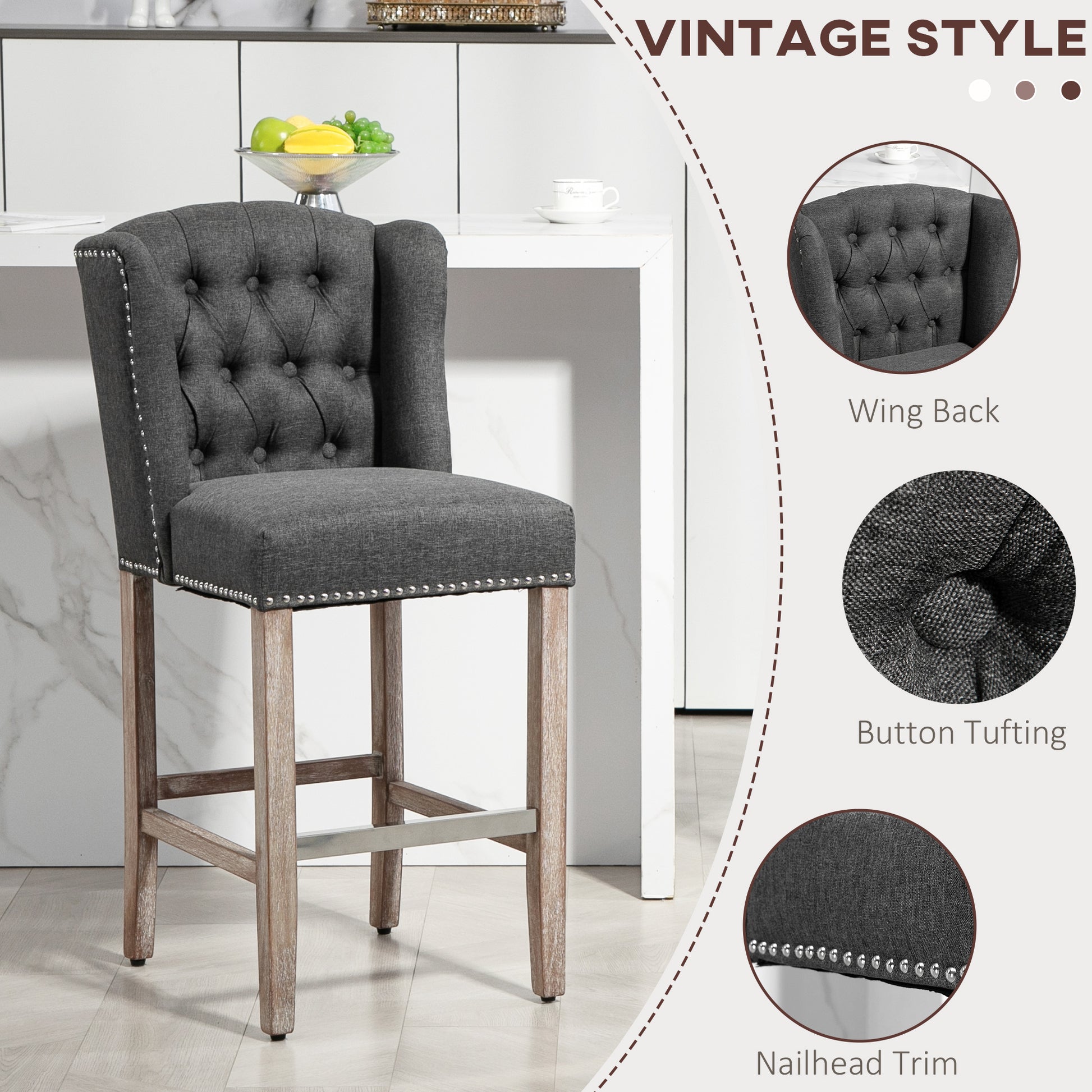 Dark gray upholstered bar stool with button tufting and nailhead trim