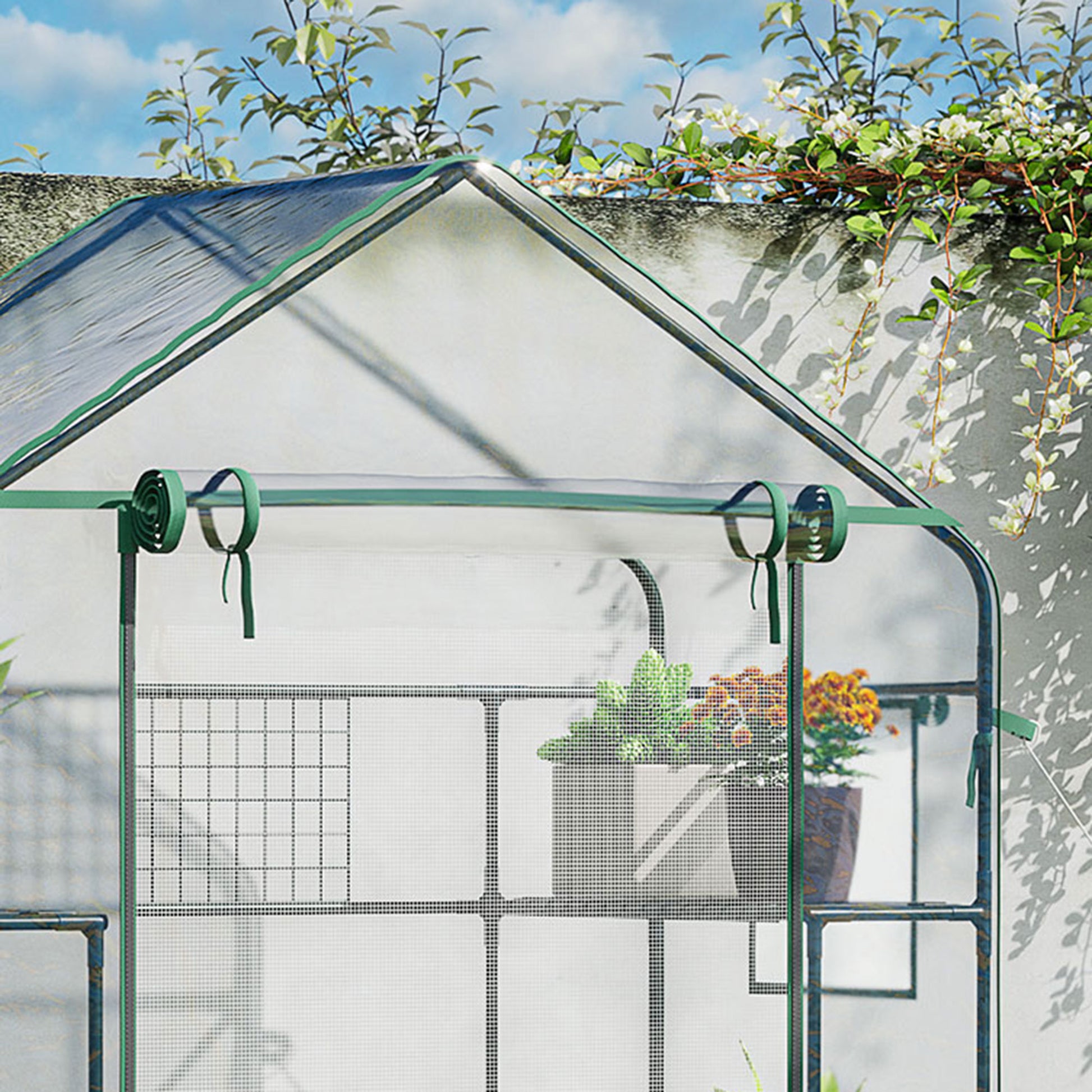 Green portable greenhouse with shelves ideal for small gardens