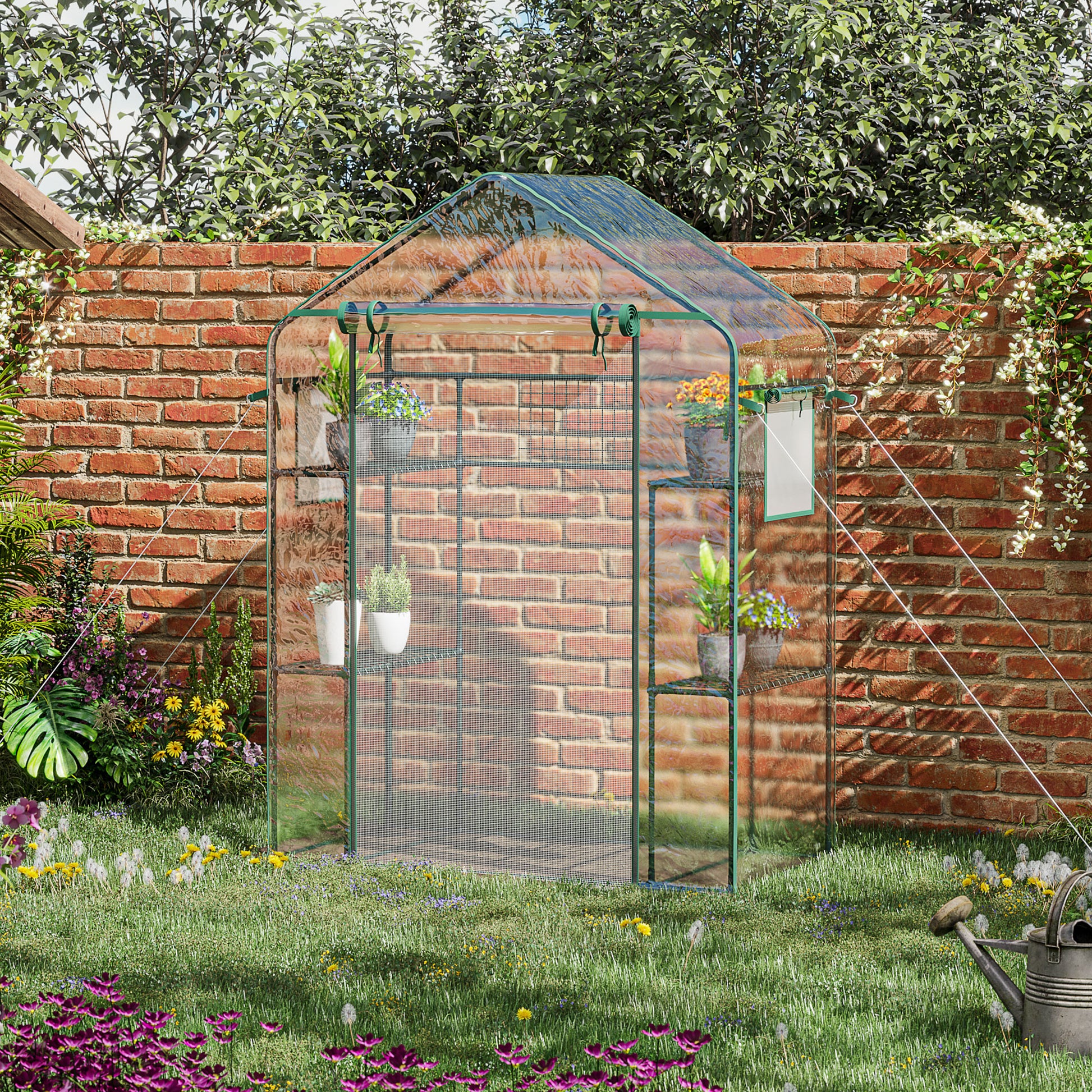 Compact green mini greenhouse with shelves ideal for small gardens and balconies