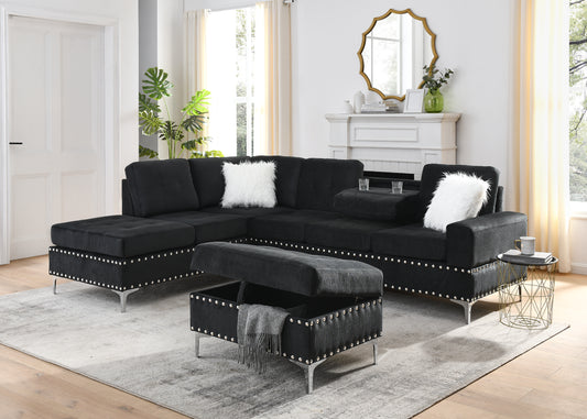 Tufted black sectional sofa with silver nailhead trim and storage ottoman