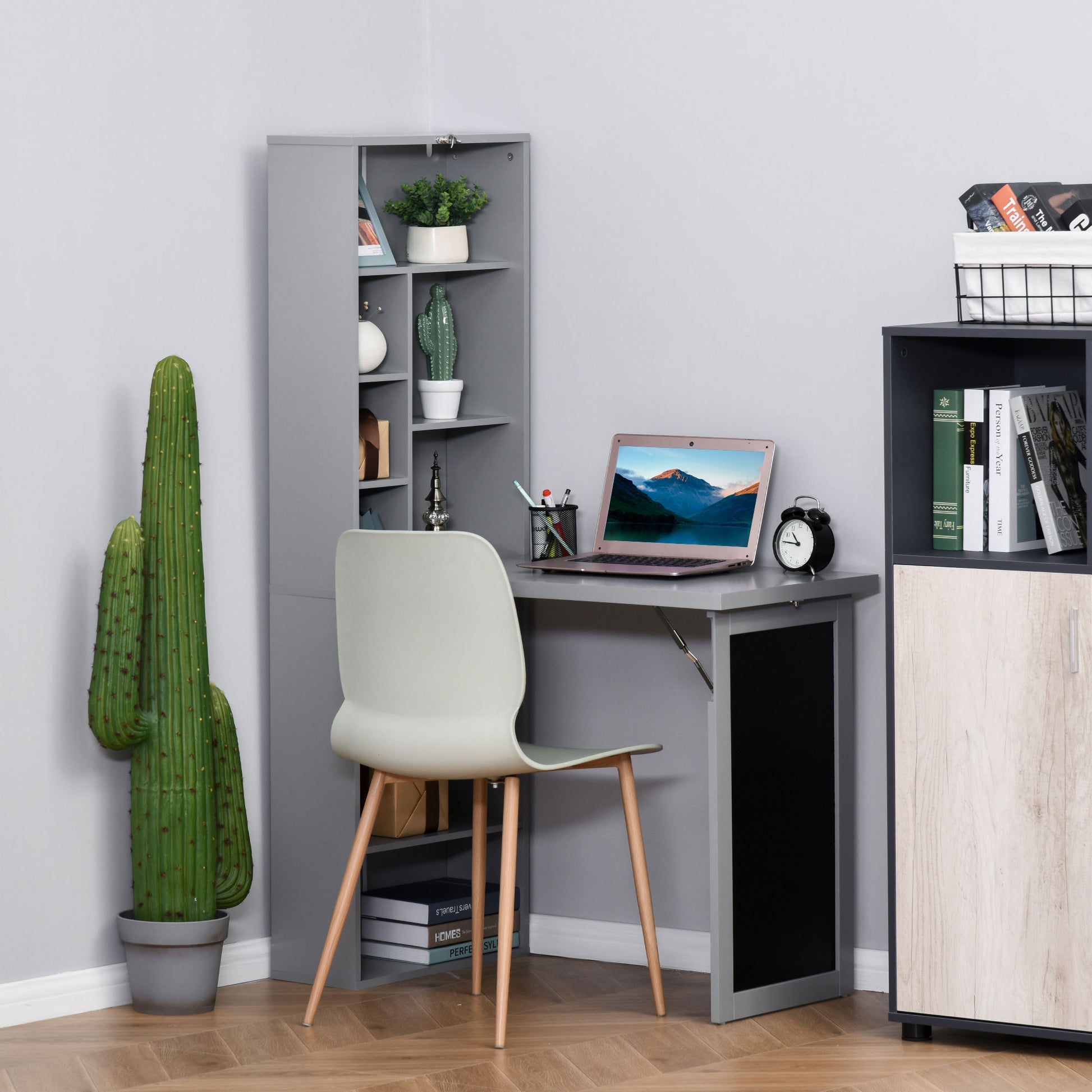 Gray folding desk with laptop and chair ideal for small home office spaces