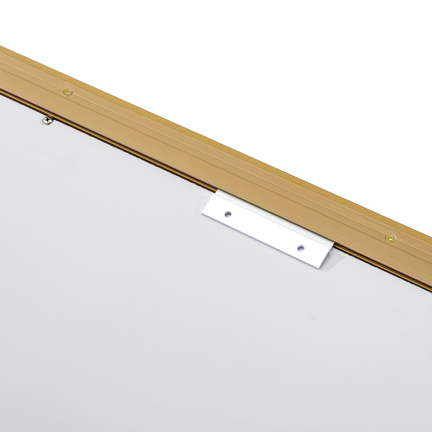 Closeup of a gold aluminum frame with silver mounting bracket and screws