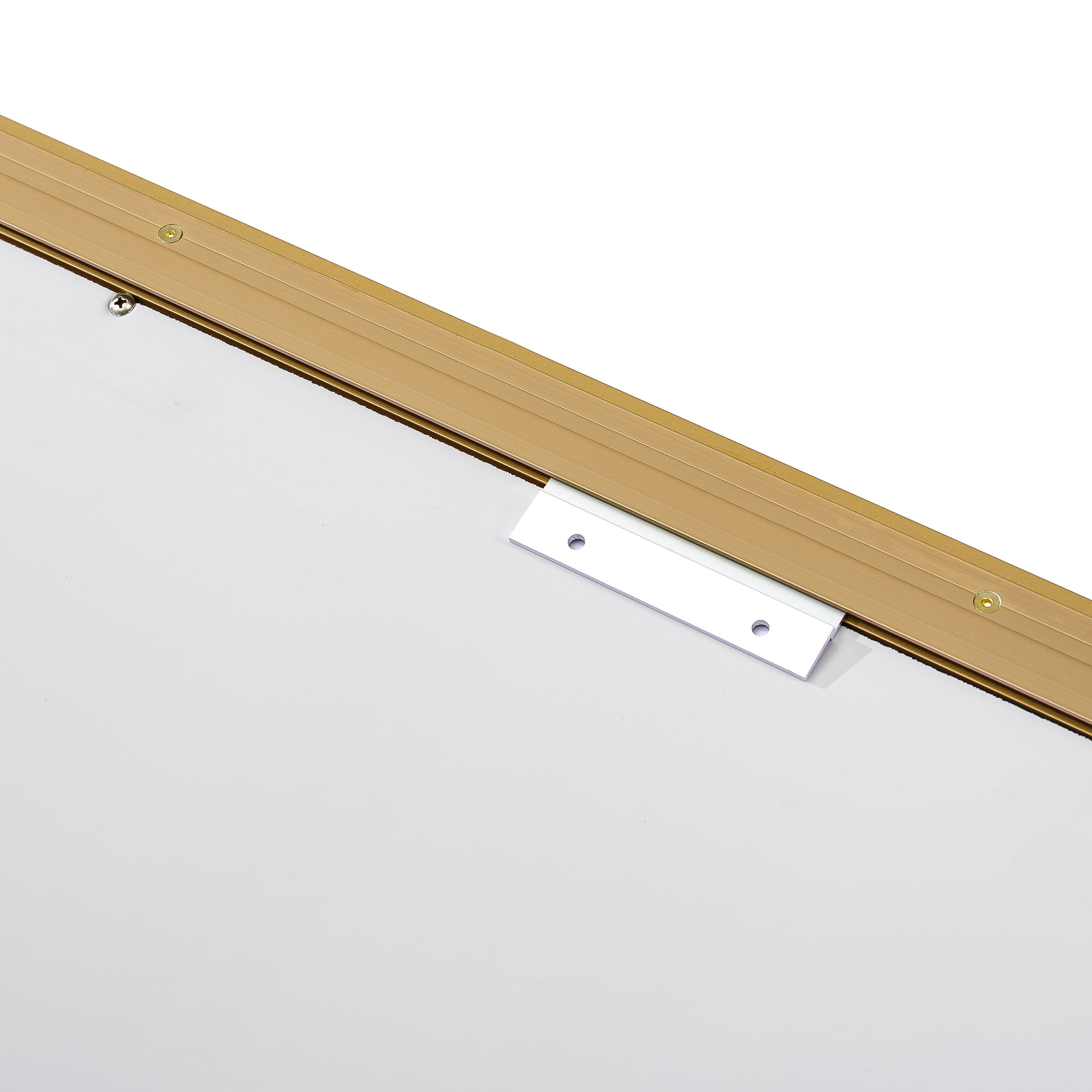 Closeup of a gold aluminum frame with silver mounting bracket and screws