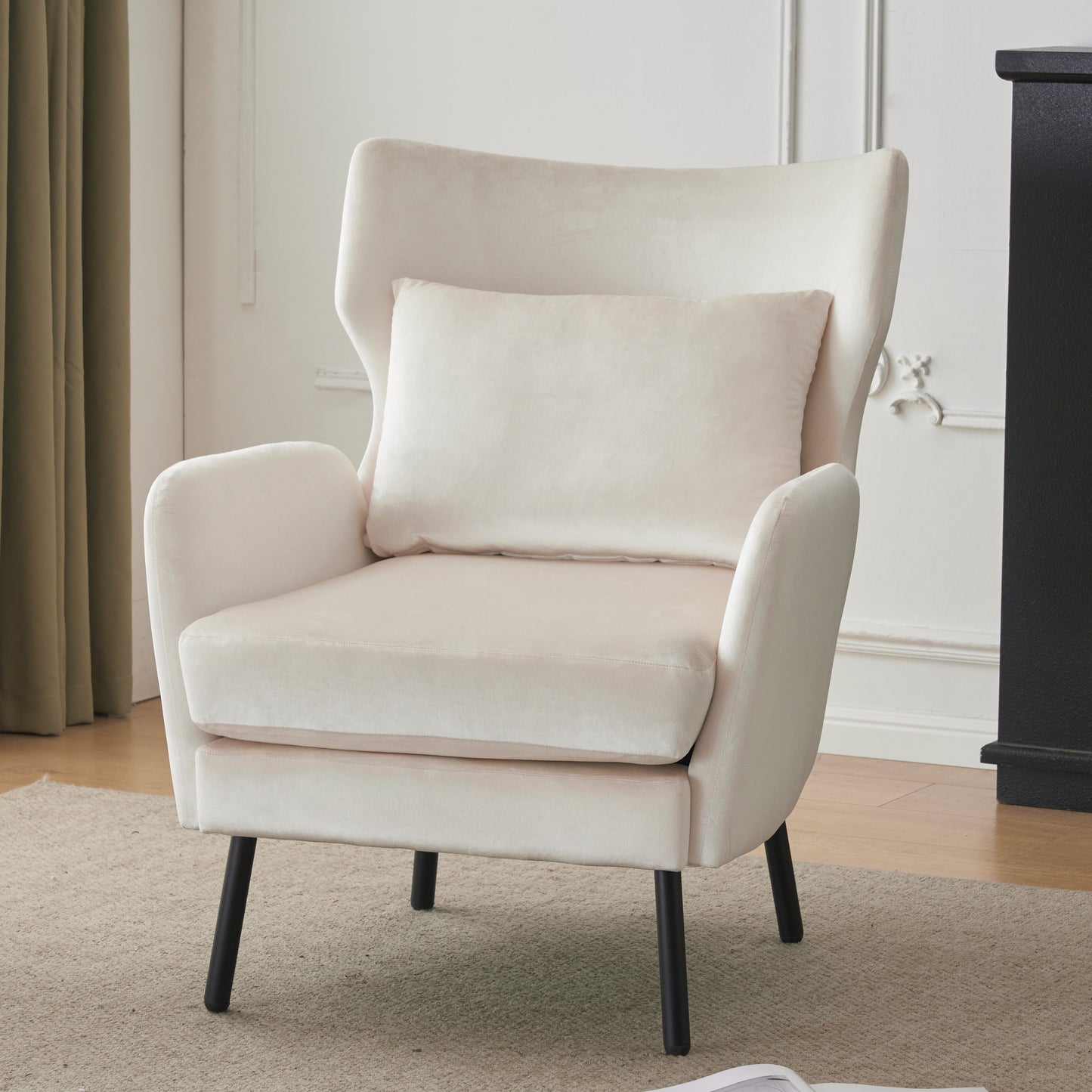 Elegant cream velvet armchair with a plush cushion and dark tapered legs perfect accent chair