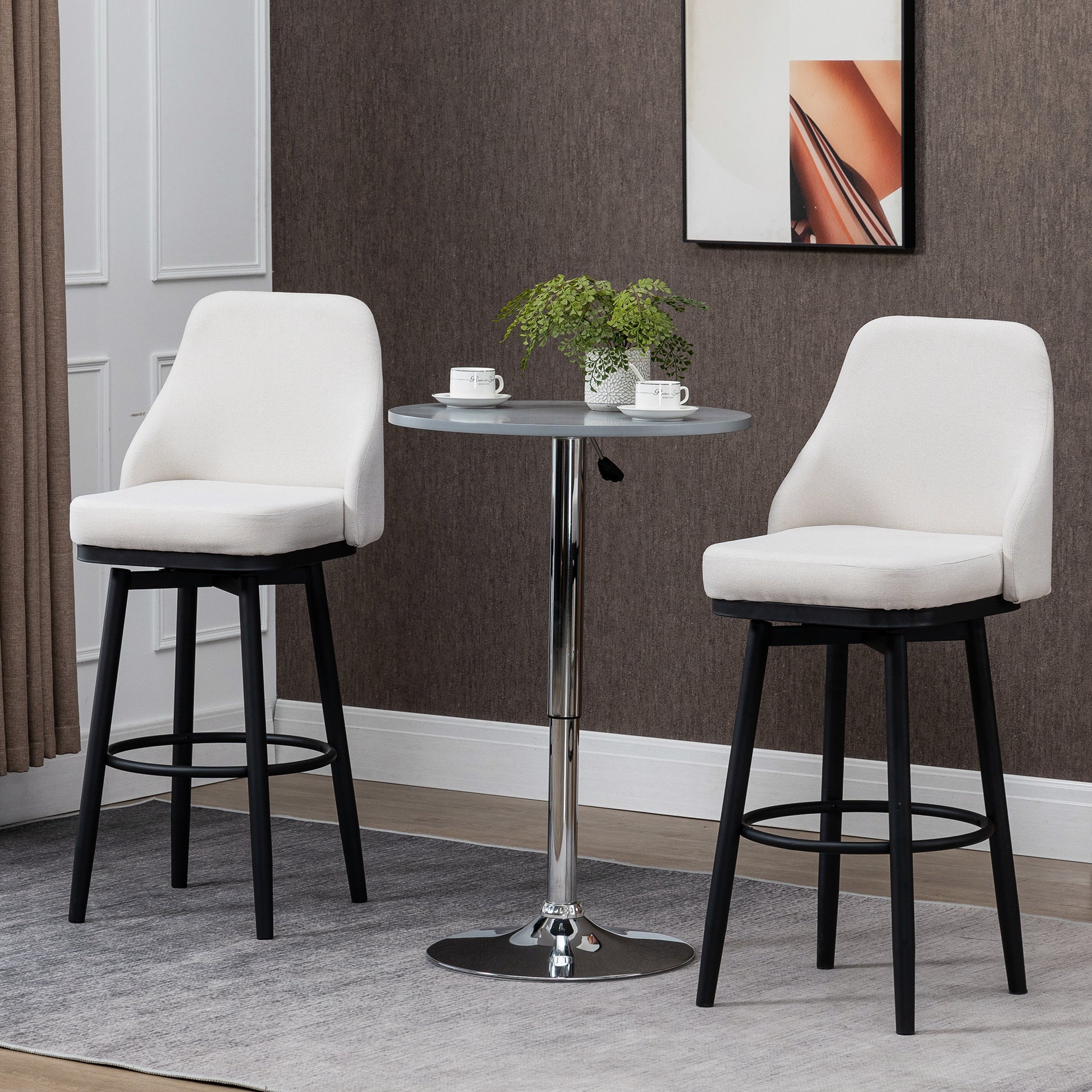 Two cream fabric bar stools with black metal legs on a gray rug