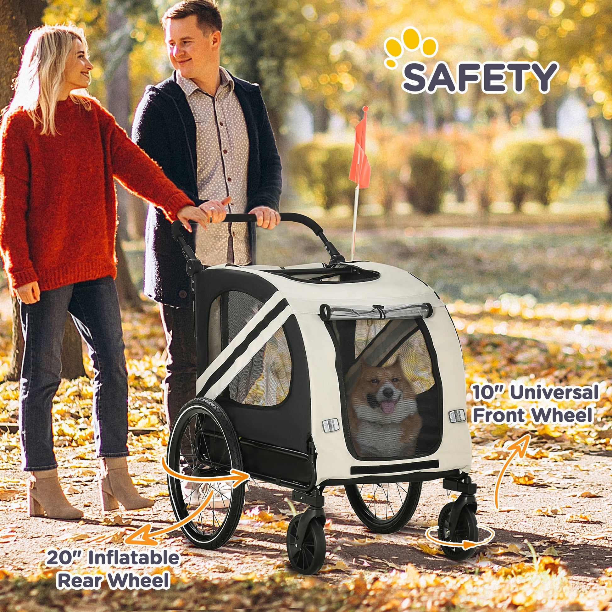 Couple pushing a cream and black dog stroller with a corgi inside