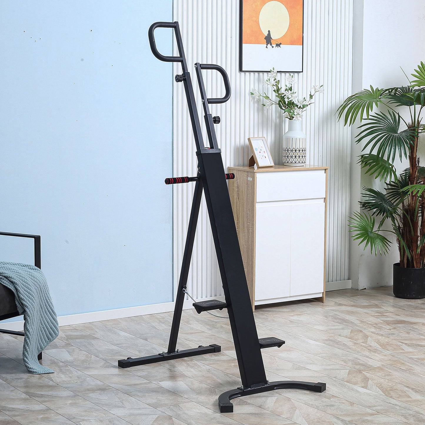 Black vertical climbing machine with red grip handles for home cardio workouts